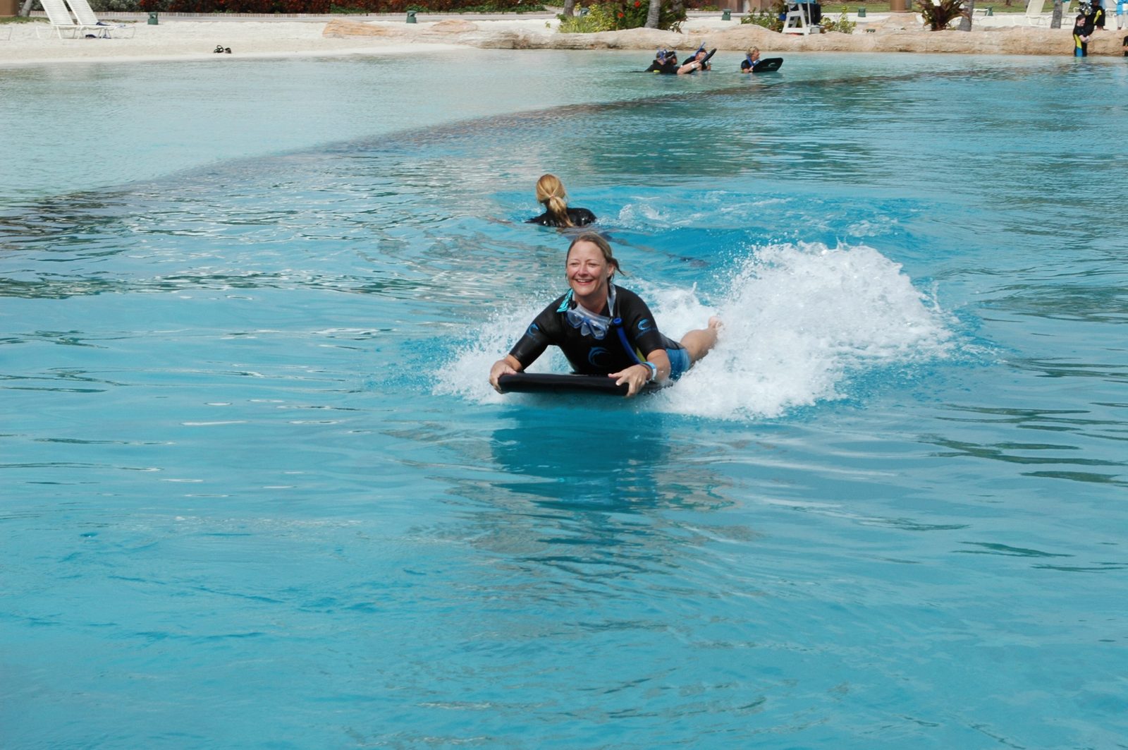 Riding the dolphin's push across the water