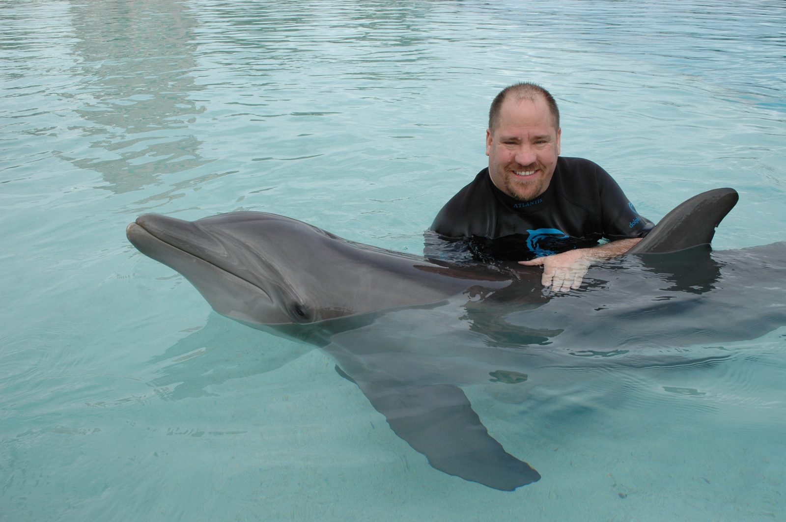 Michael with the dolphin at Dolphin Cay