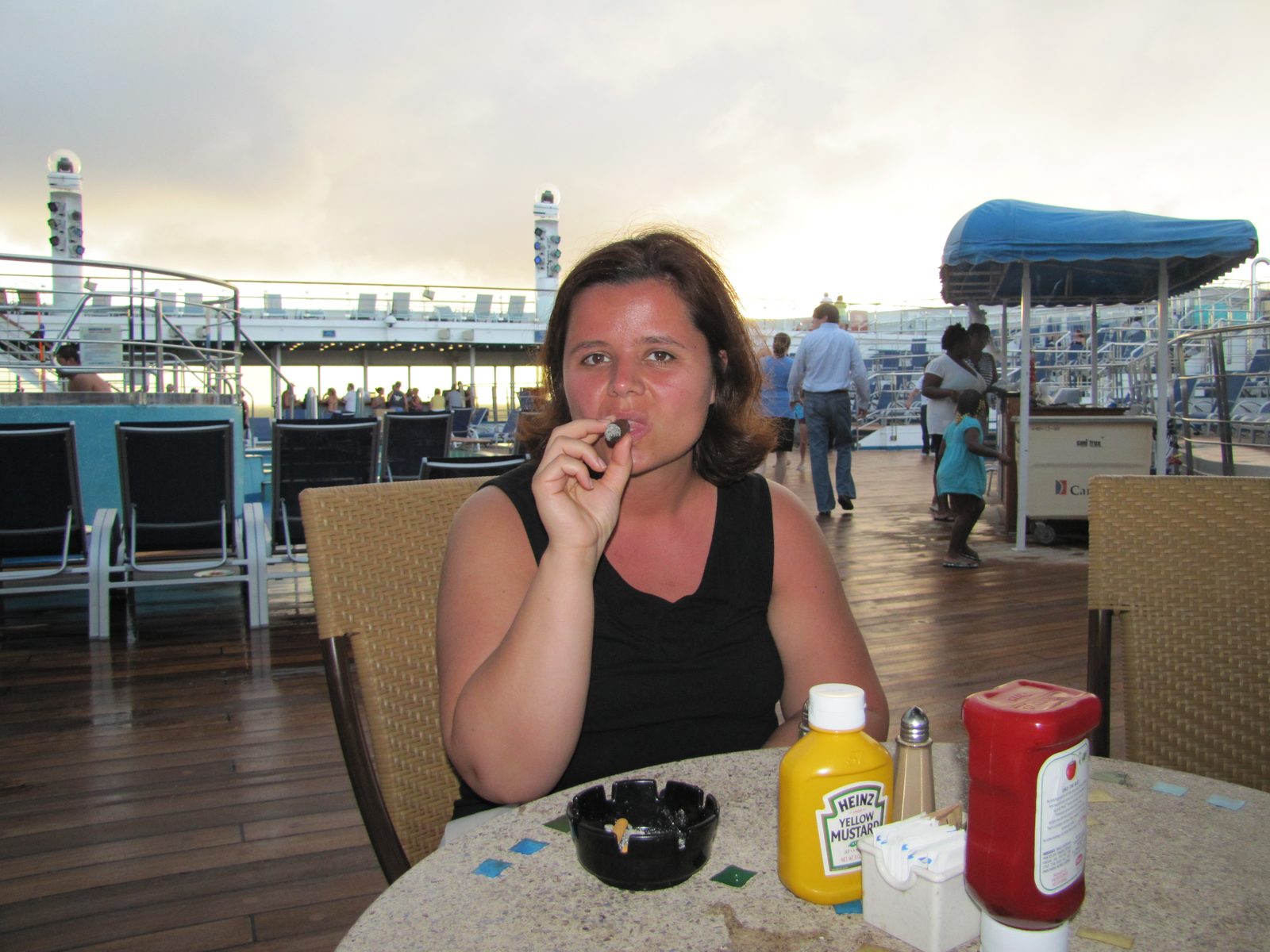 Kathy with a cigar on deck leaving Grand Turk