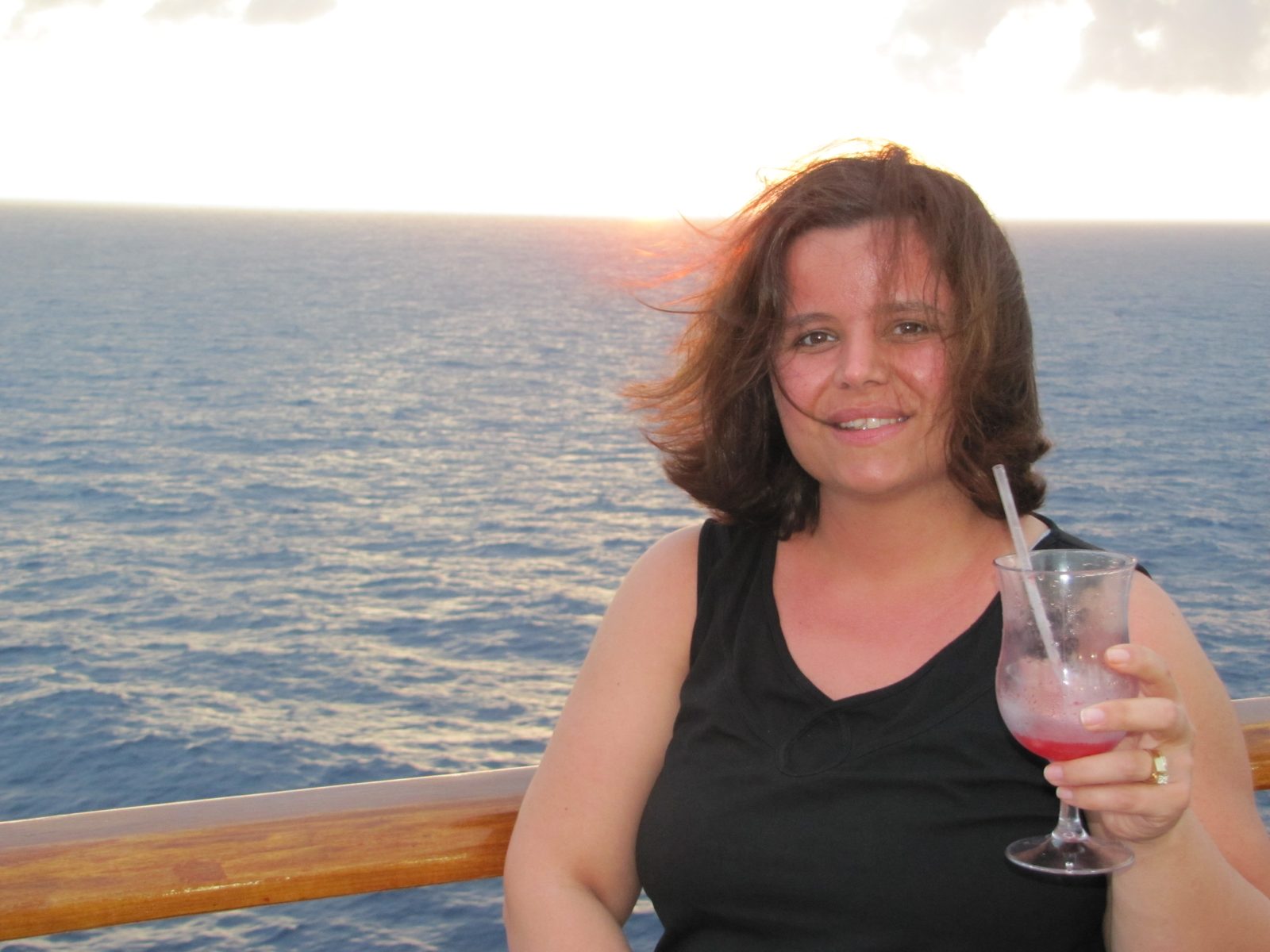 Kathy with her drink as the sun set