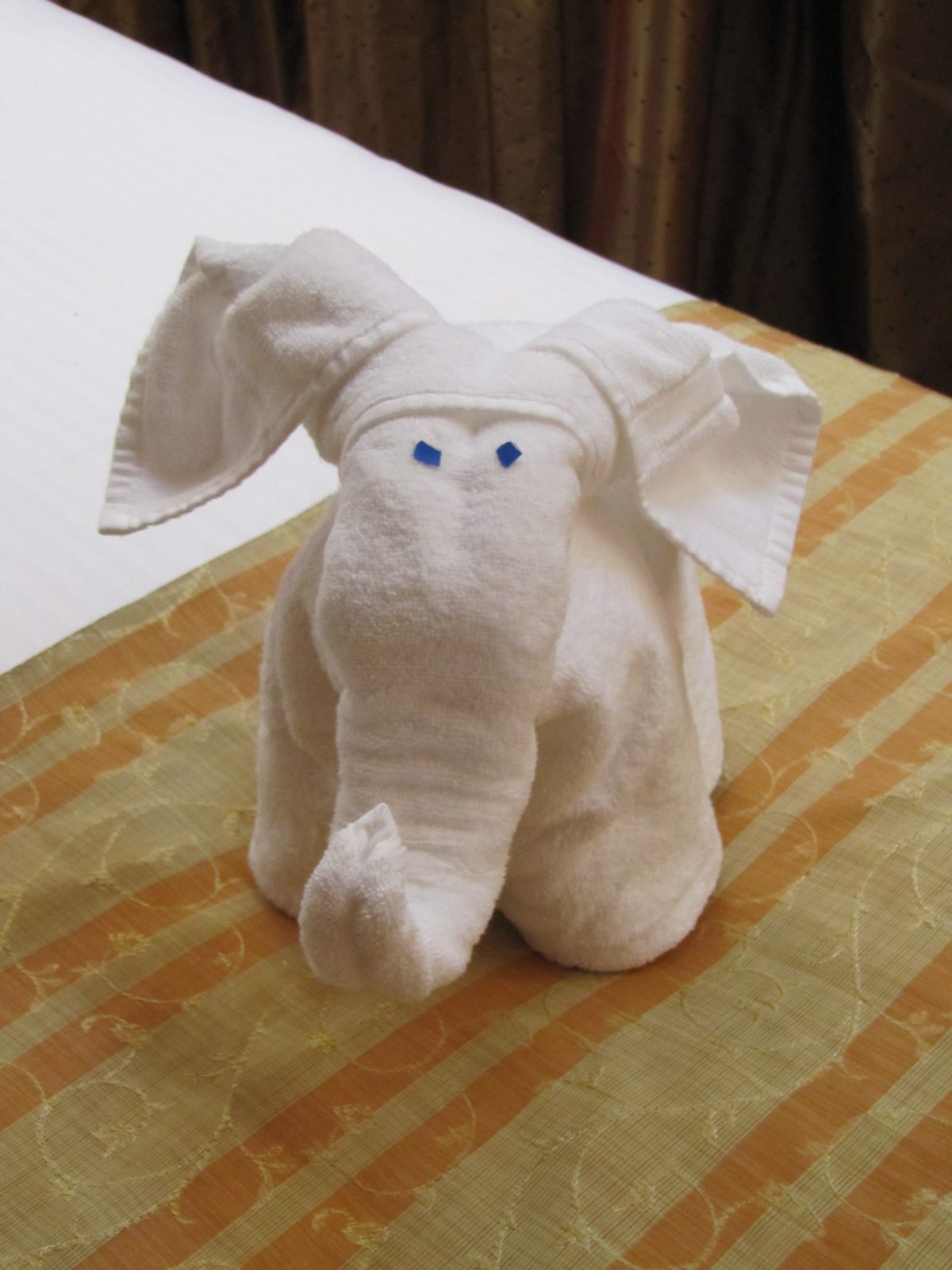 Towel elephant waiting on our bed