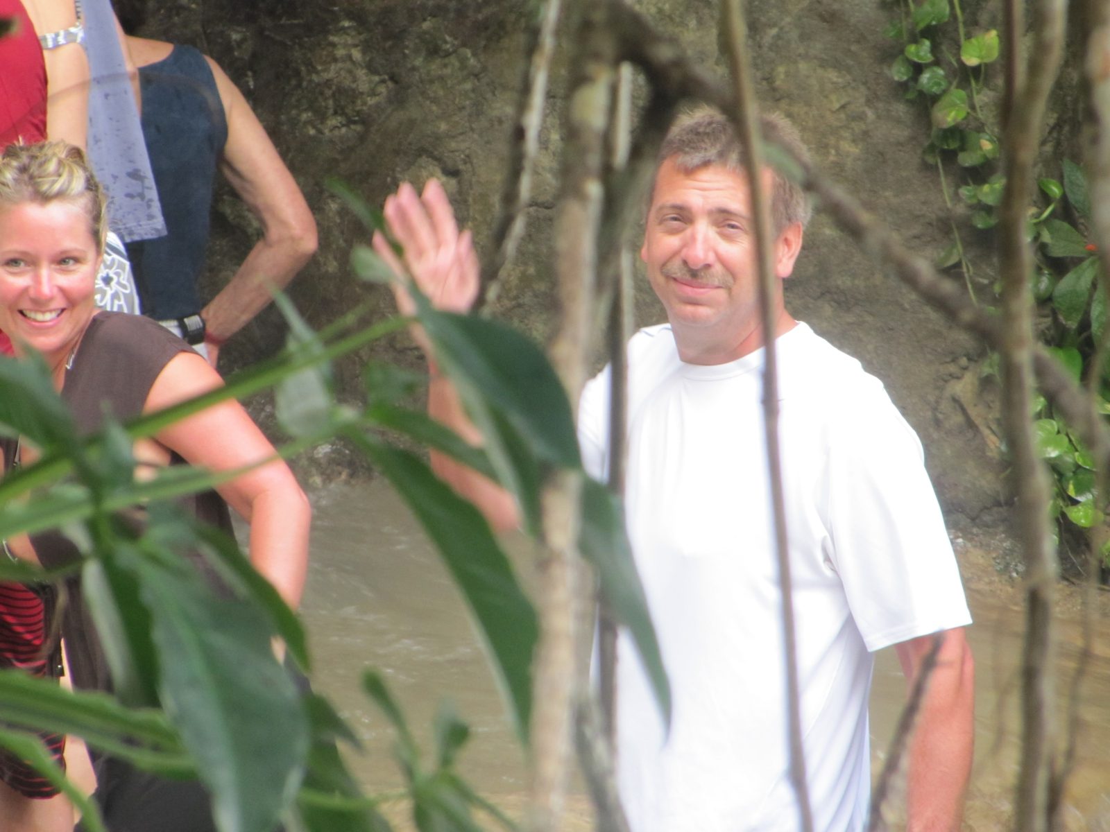 Darrell waving beside the falls at Dunn's River