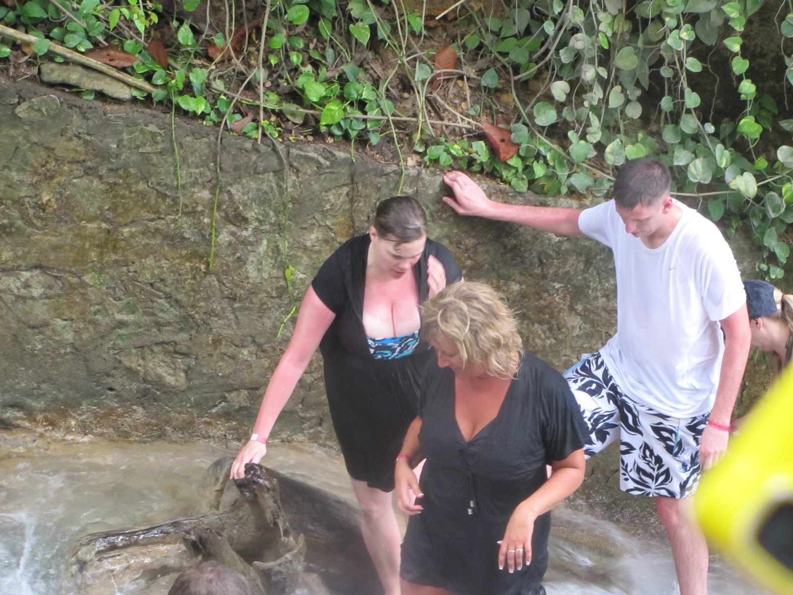 Climbing the falls hand in hand with friends