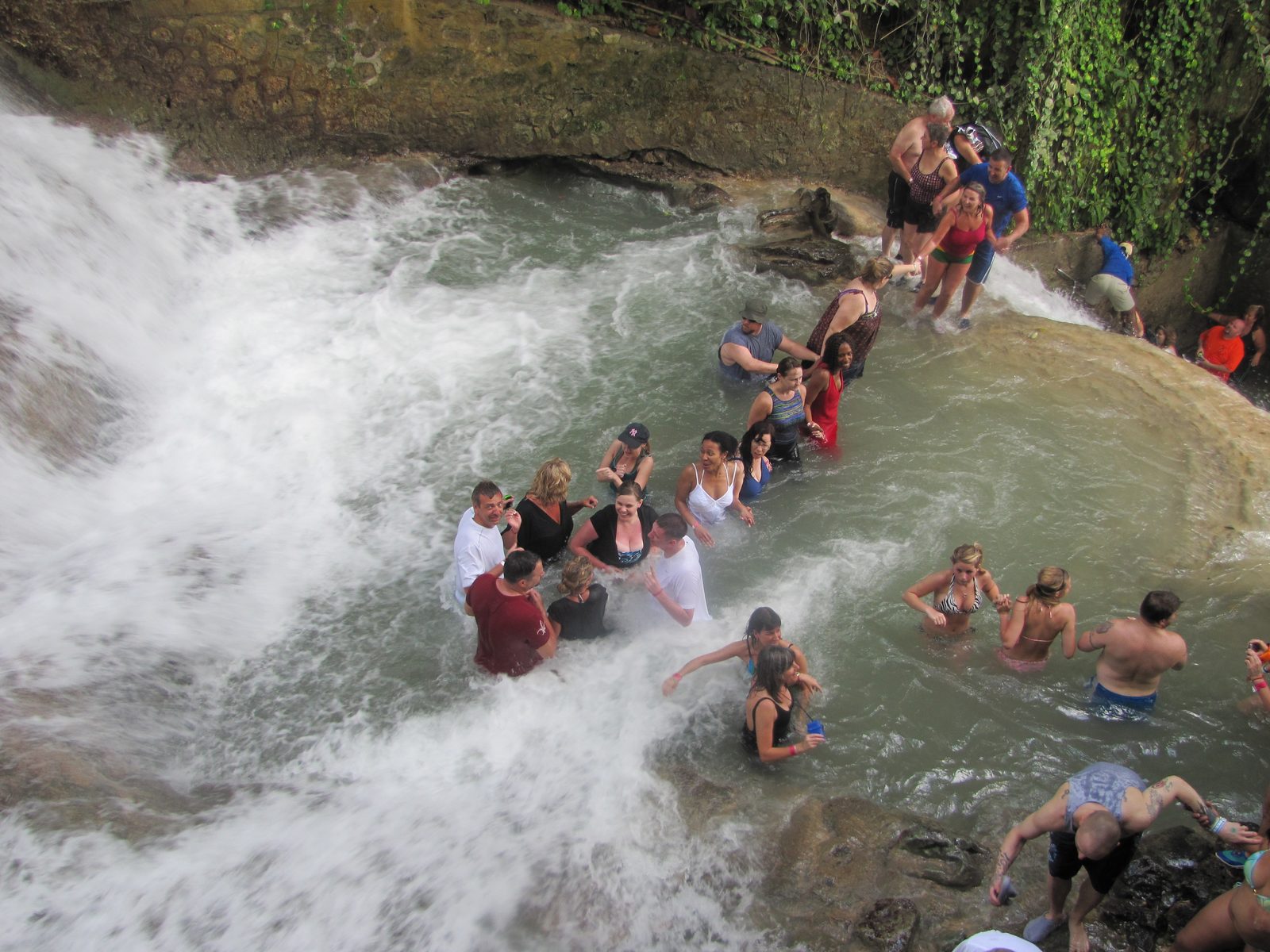 The long human chain crossing through the falls