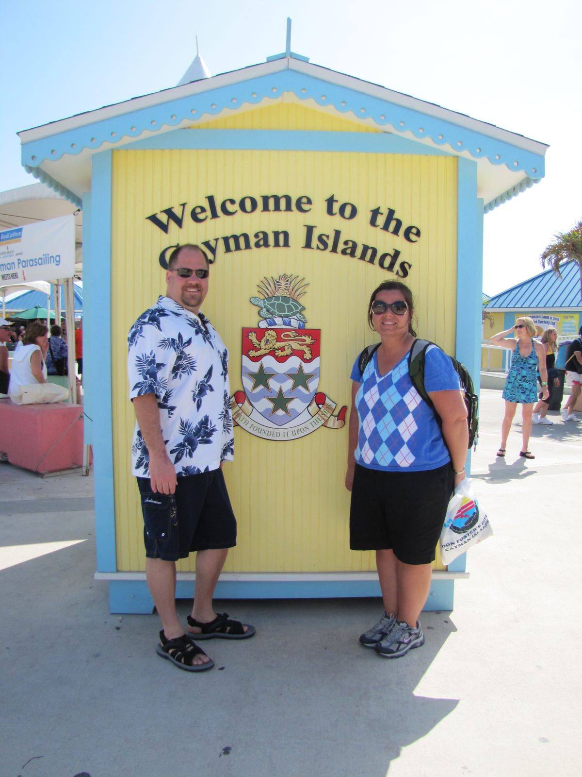 Kathy and me at the Welcome to the Cayman Islands sign