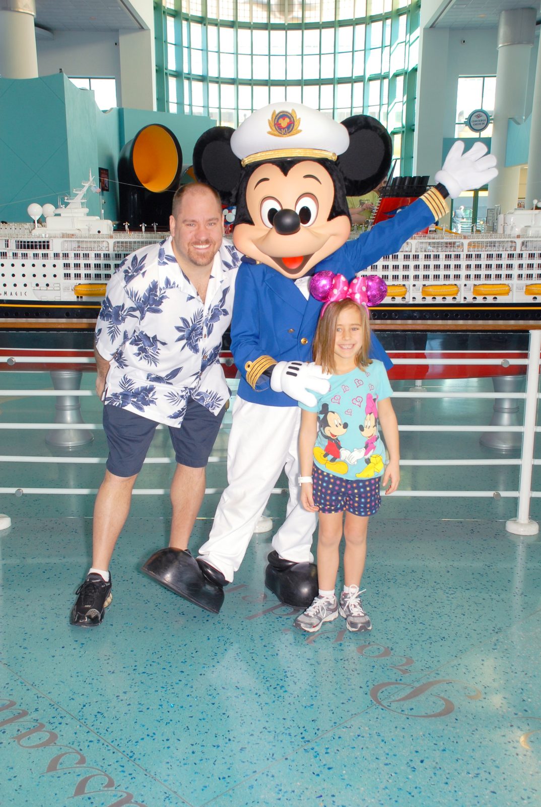 Michael, Captain Mickey and Lisa in the Port Canaveral cruise terminal