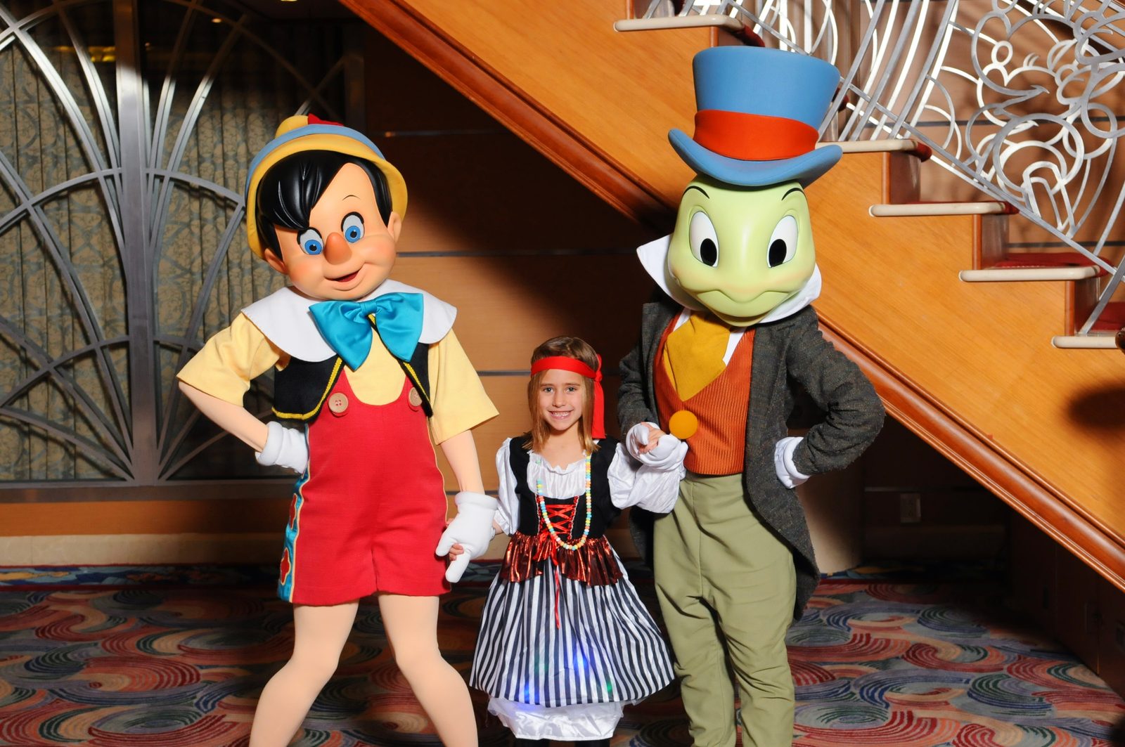 Pinocchio, Lisa and Jiminy Cricket on Pirate Night in the Lobby Atrium