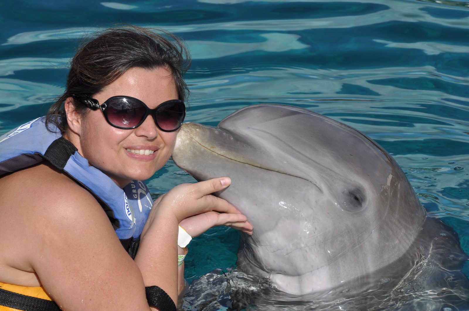 Kathy gets a dolphin kiss