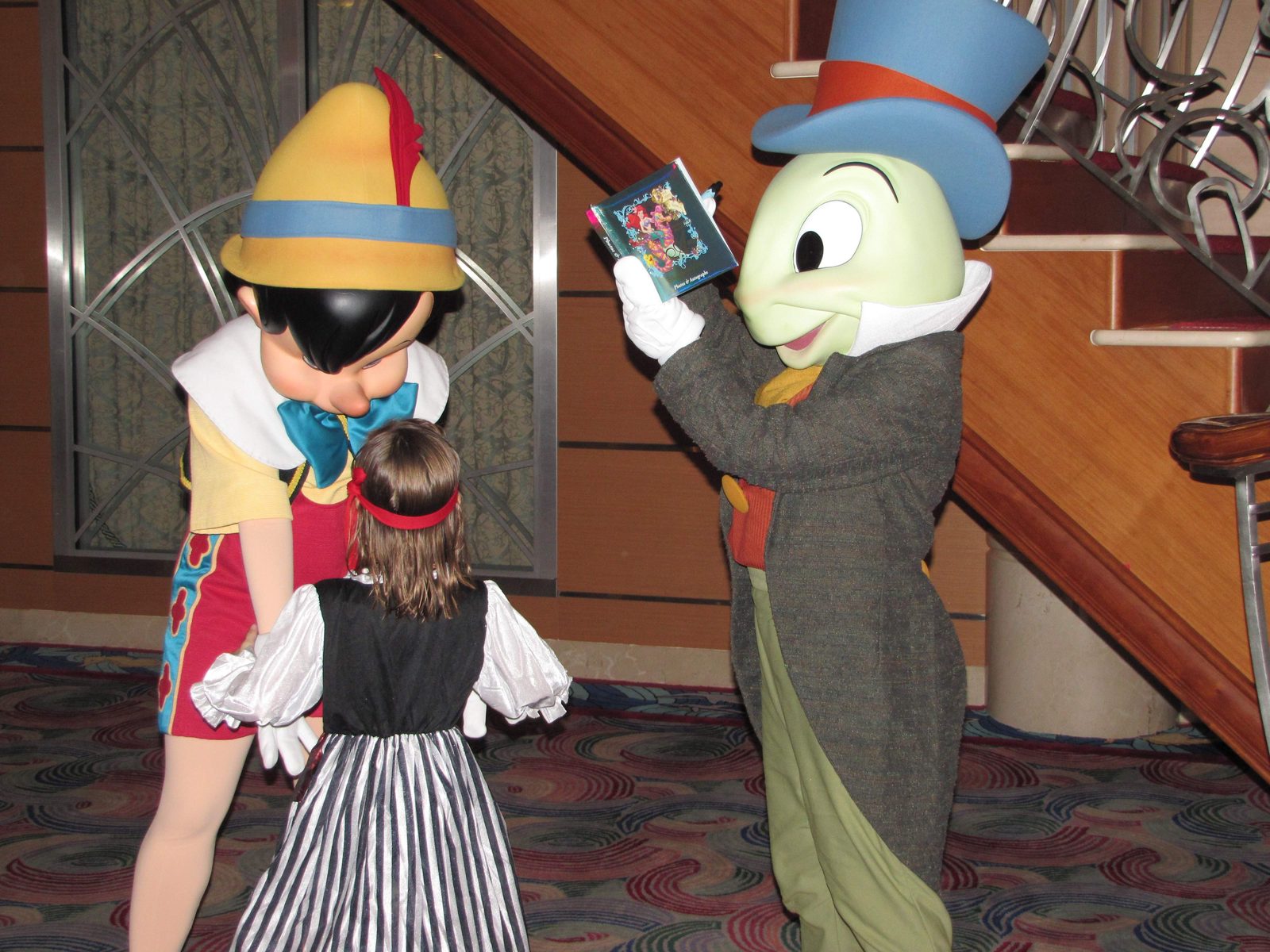 Lisa with Pinocchio and Jiminy Cricket in the Lobby Atrium