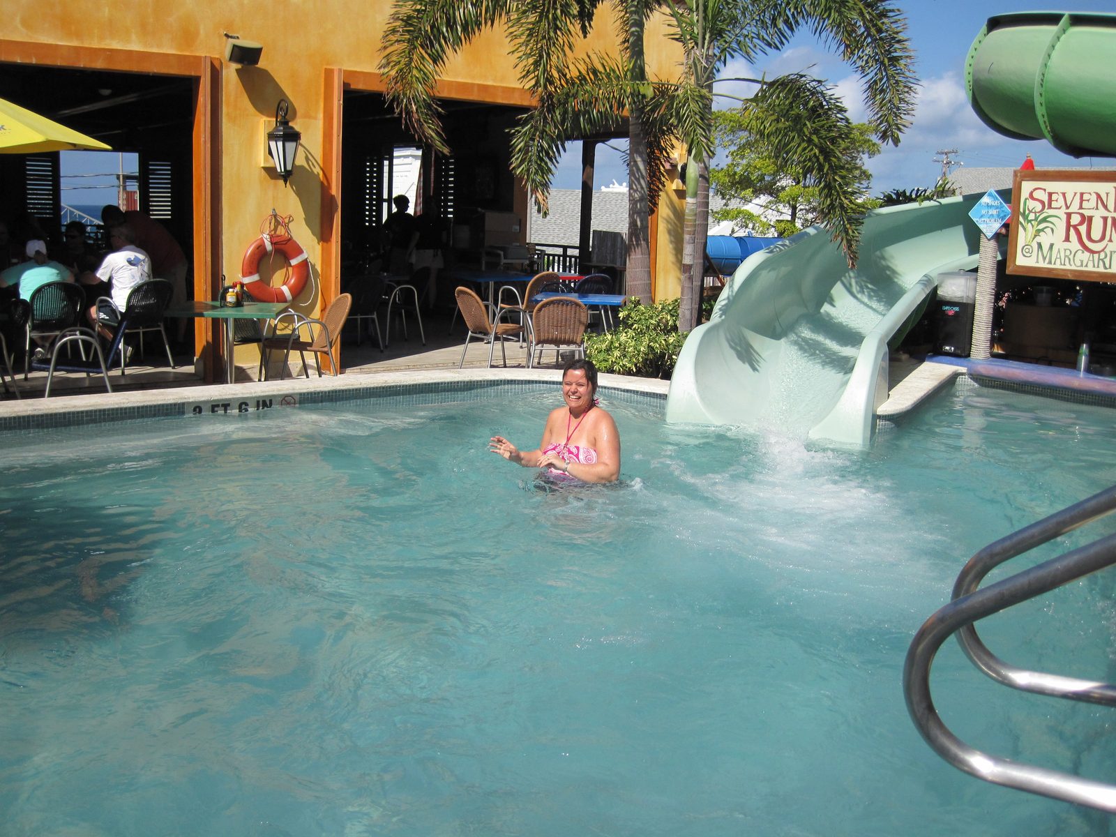 Kathy in the pool by the slide at Margaritaville