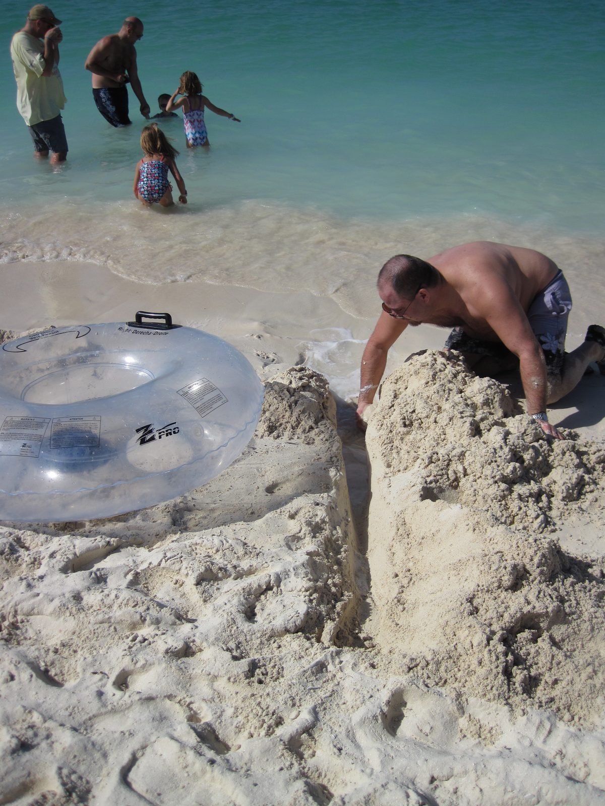 Michael digging our sand hole on Castaway Cay