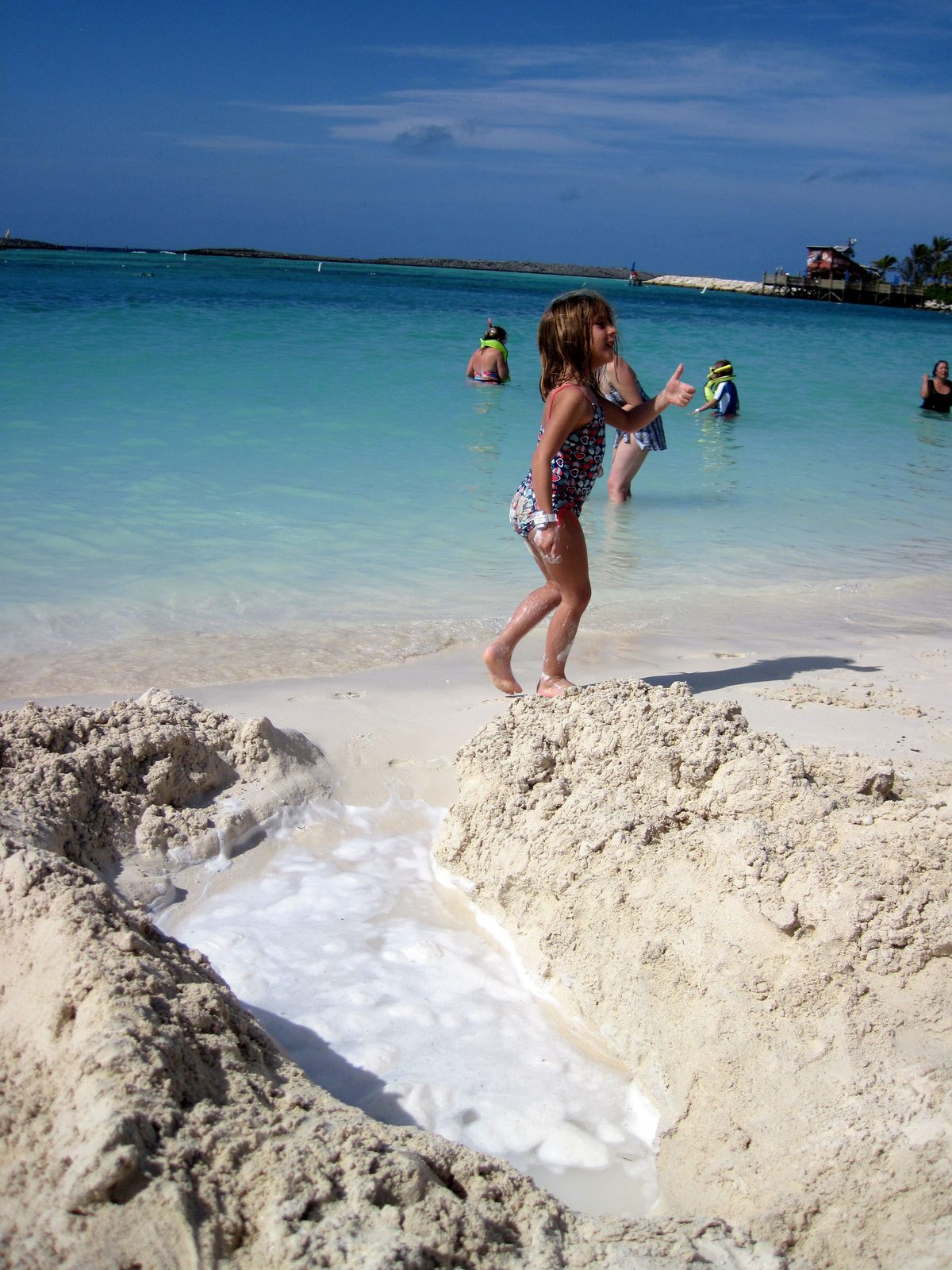 Our sand hole filling with water on Castaway Cay