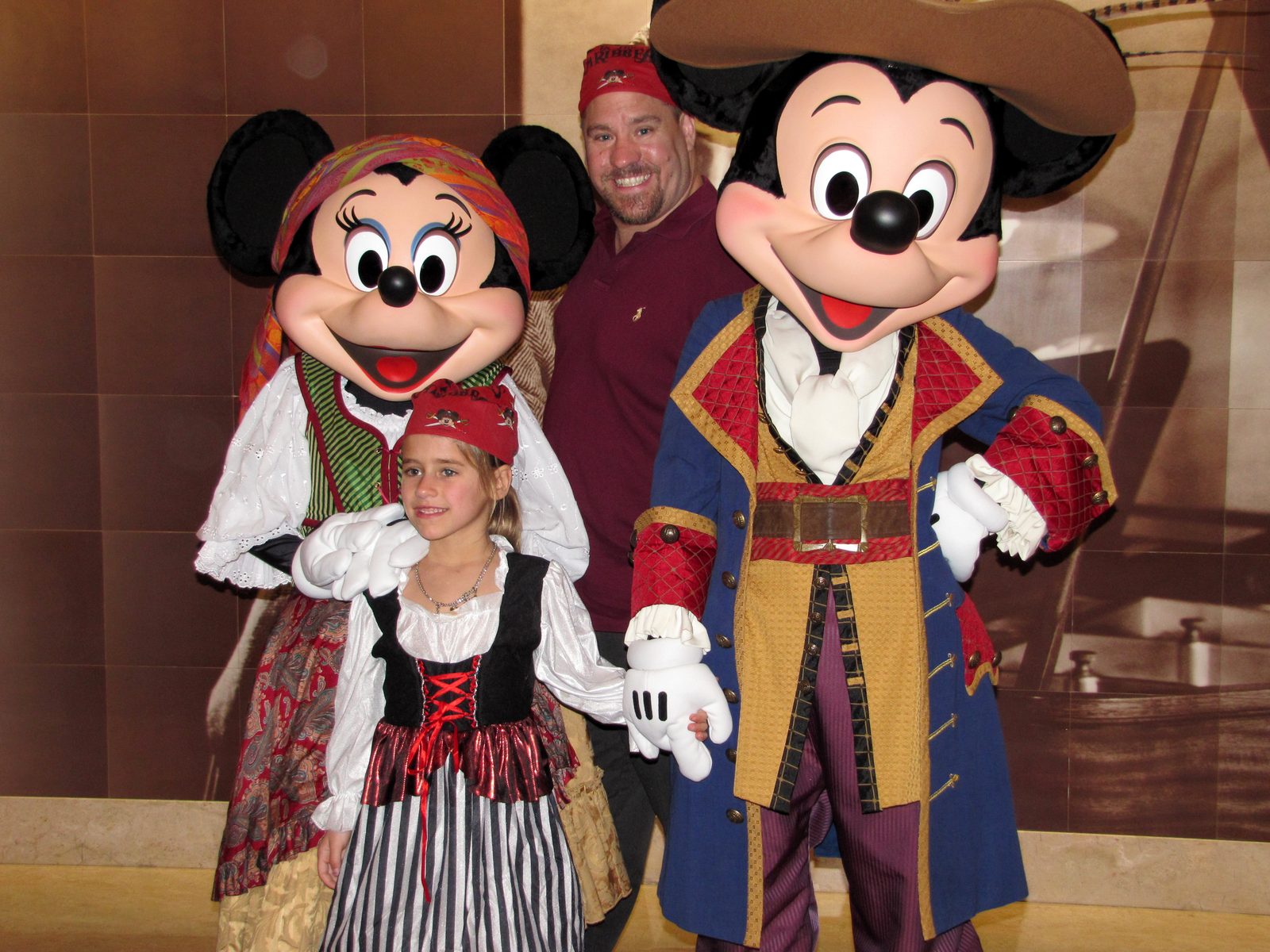 Minnie, Lisa, Michael and Mickey in pirate garb on Pirate Night