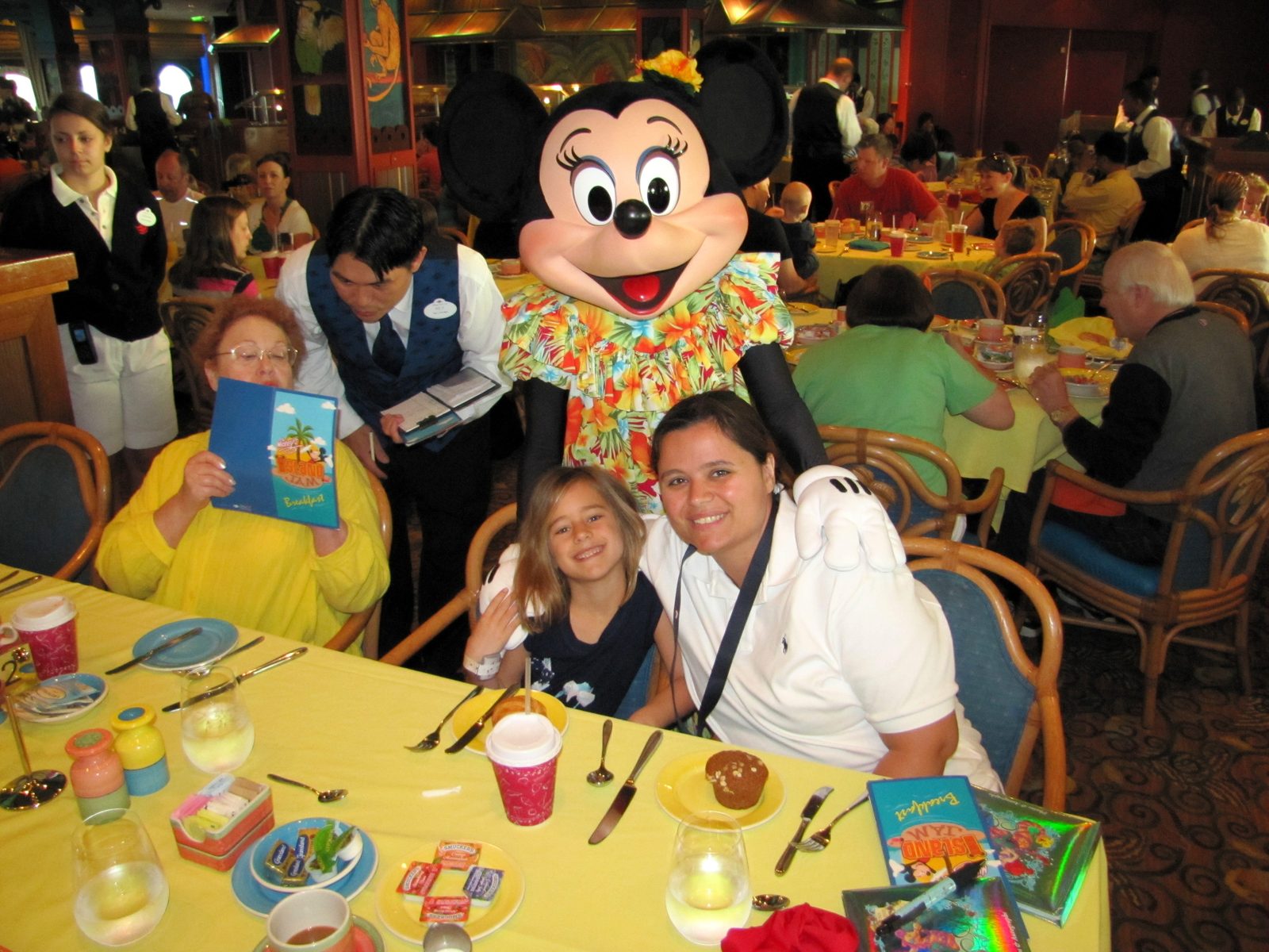 Lisa and Kathy with Minnie in her aloha shirt at the character breakfast