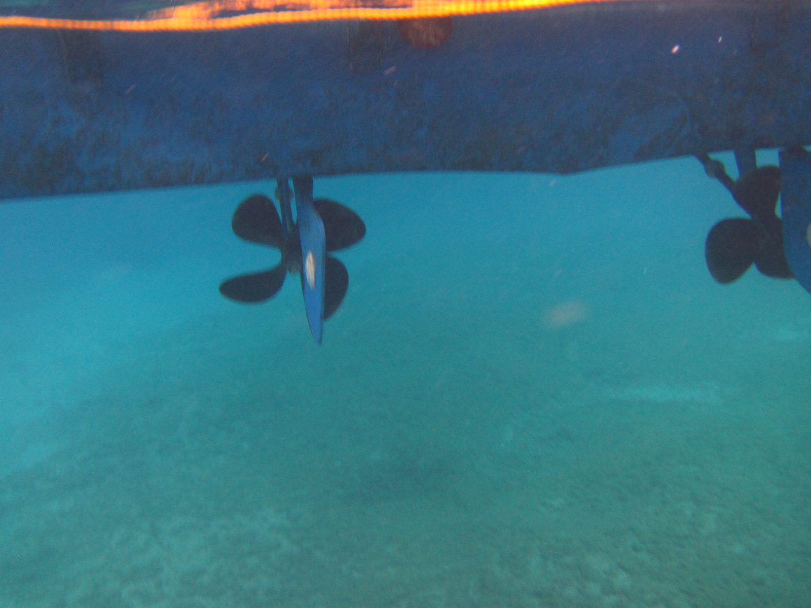 The hull and propellers from the water at Grand Cayman