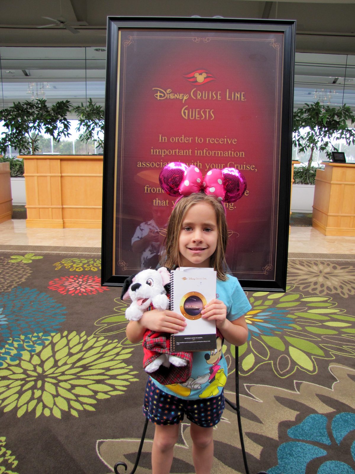 Lisa checking in under the Disney Cruise Line sign