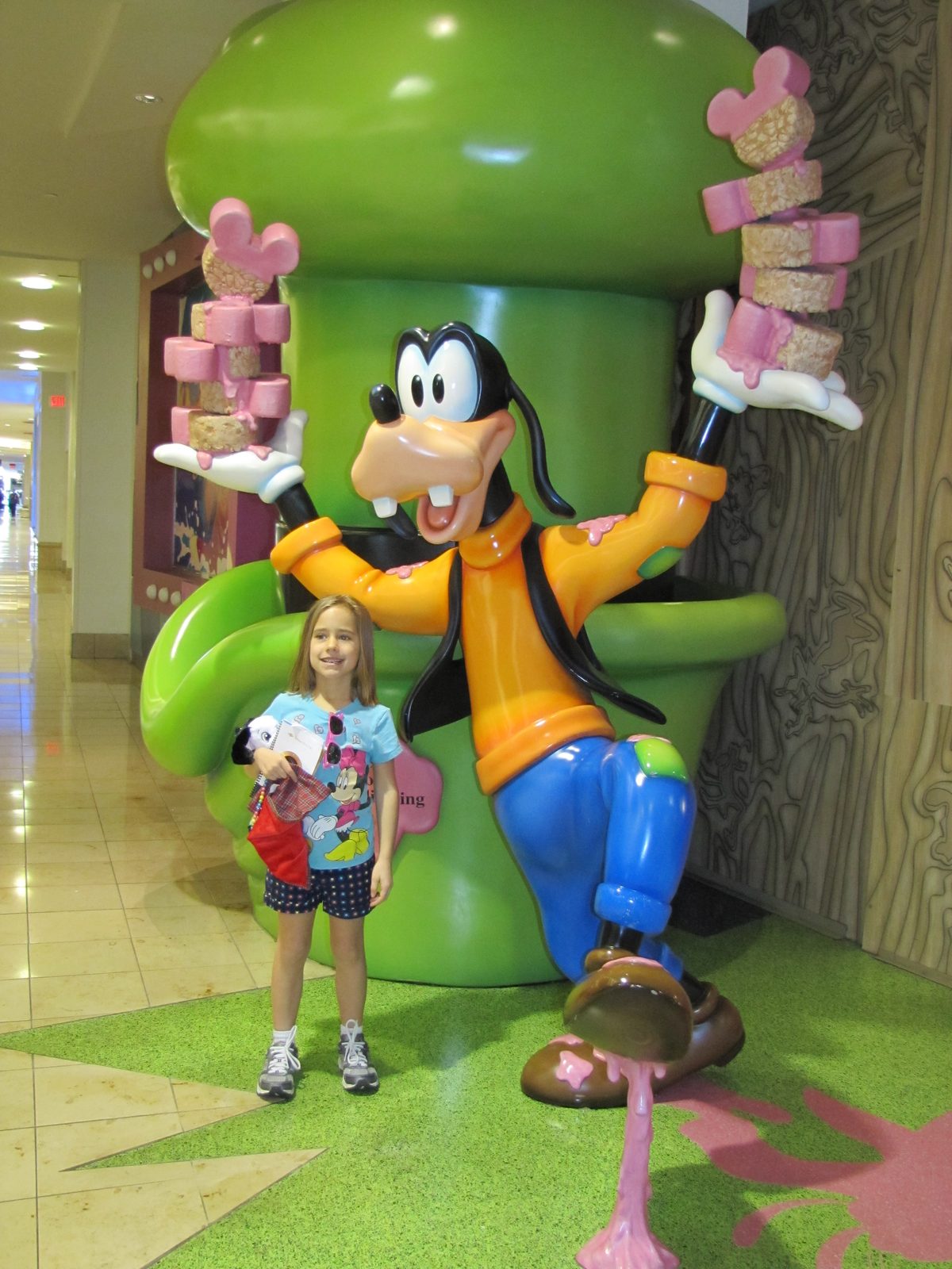 Lisa by a Goofy statue near the terminal