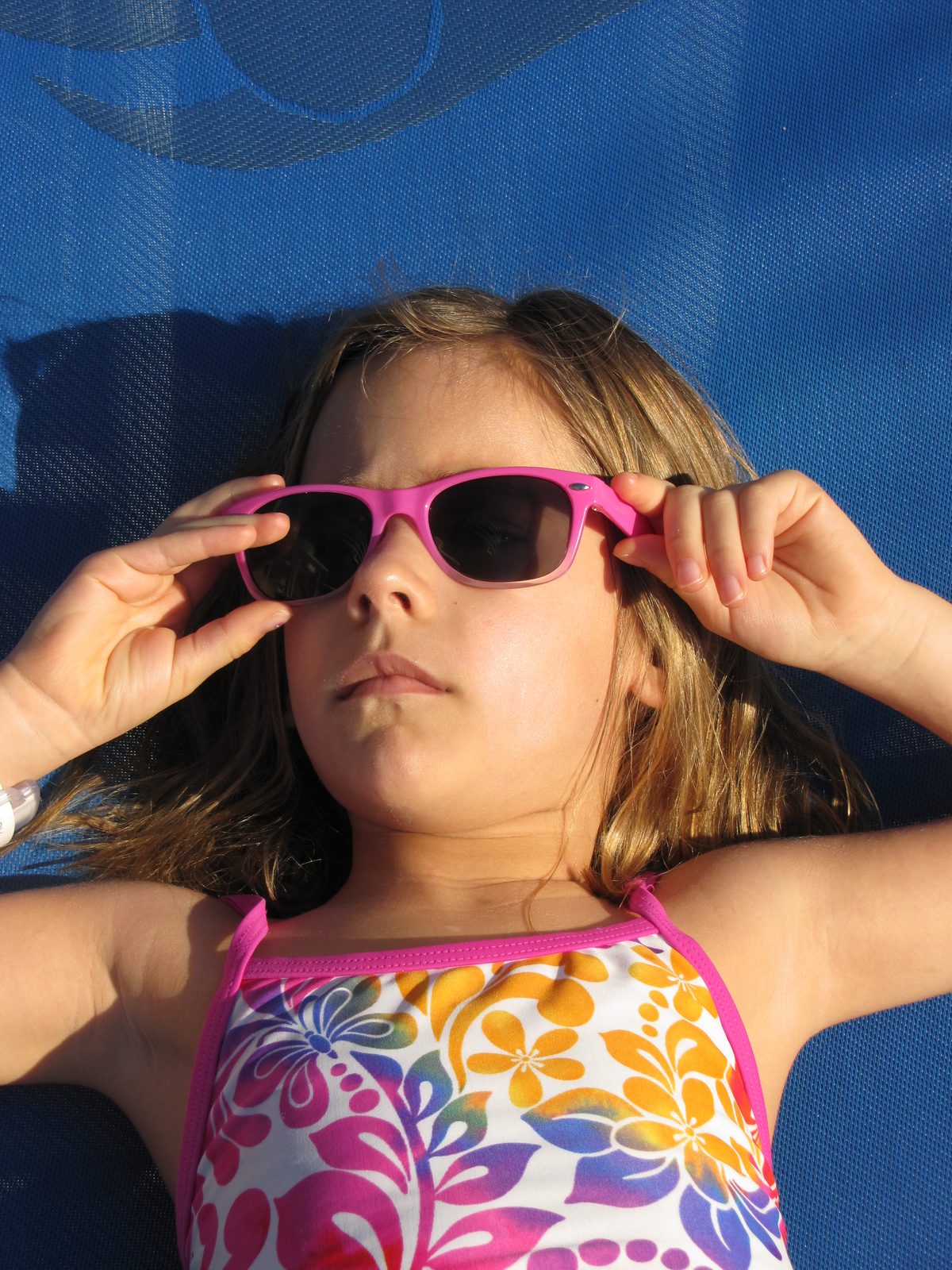Lisa sunning on the pool deck of the Magic