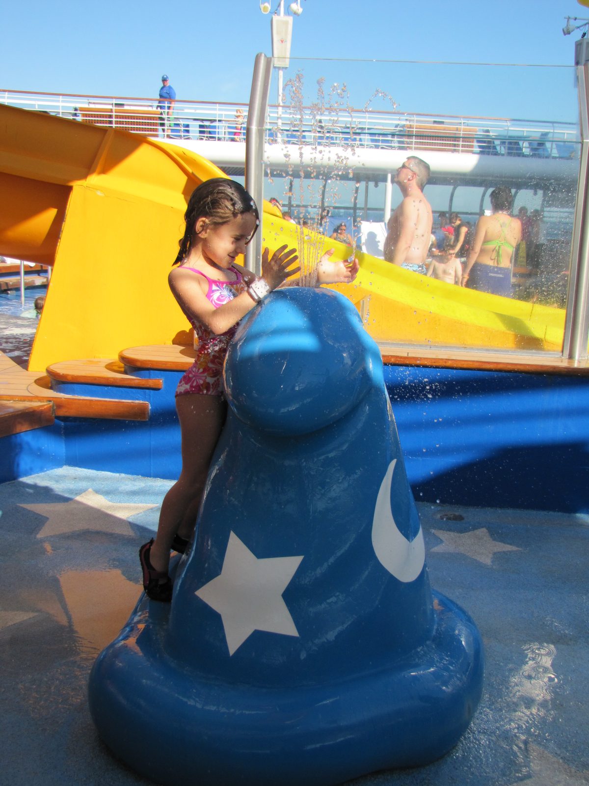 Lisa climbing the pool slide
