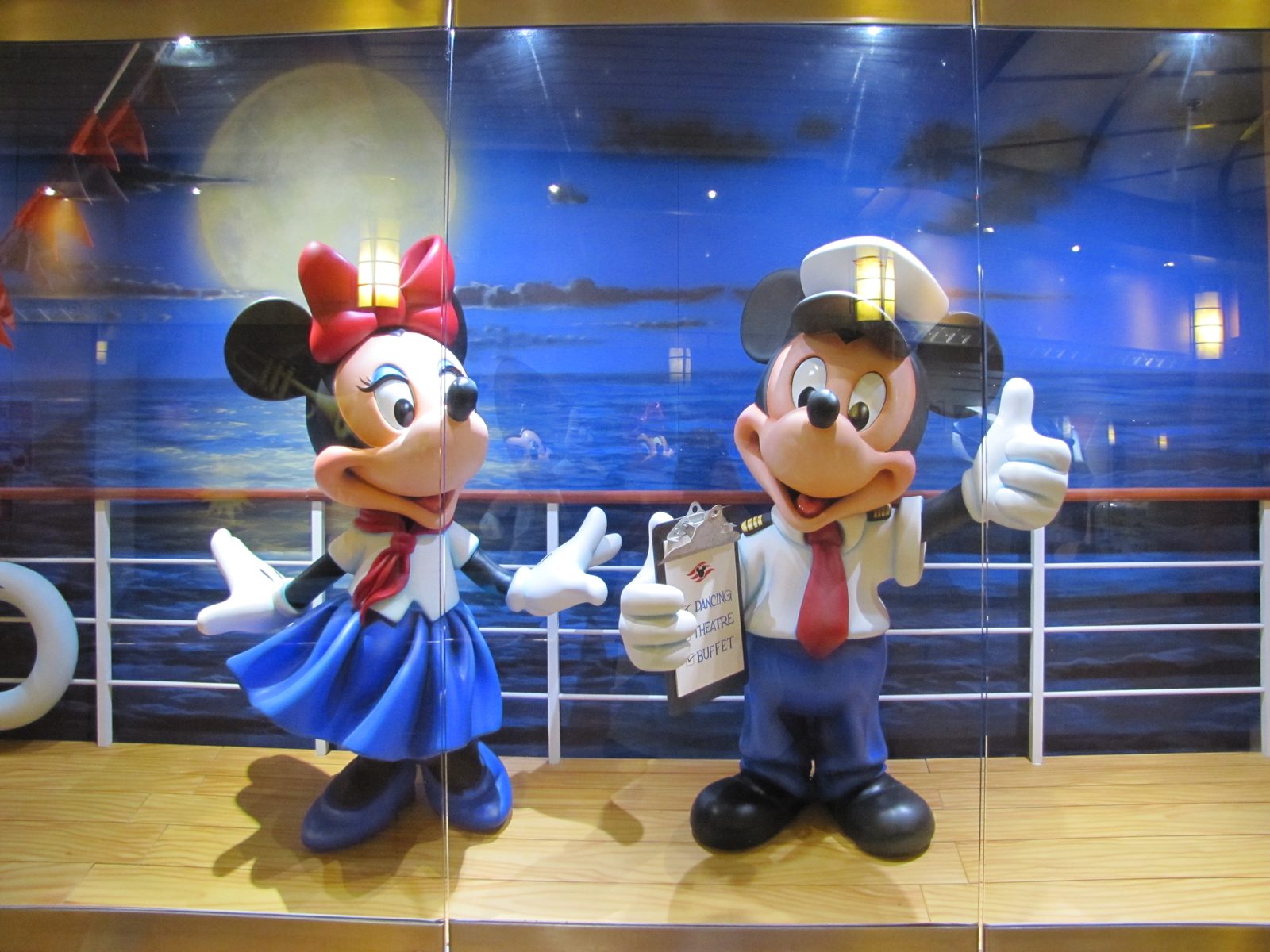 Mickey and Minnie standing watch by the atrium stairs