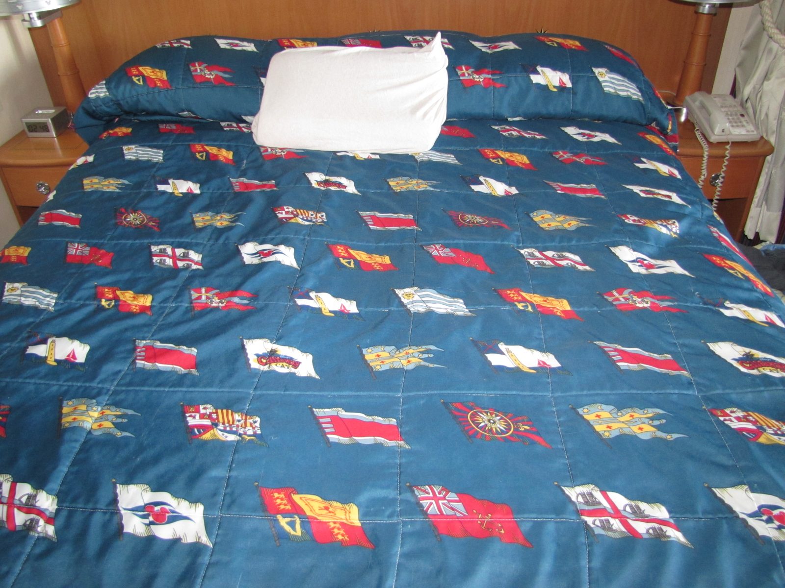 The nautical bedspread in our stateroom