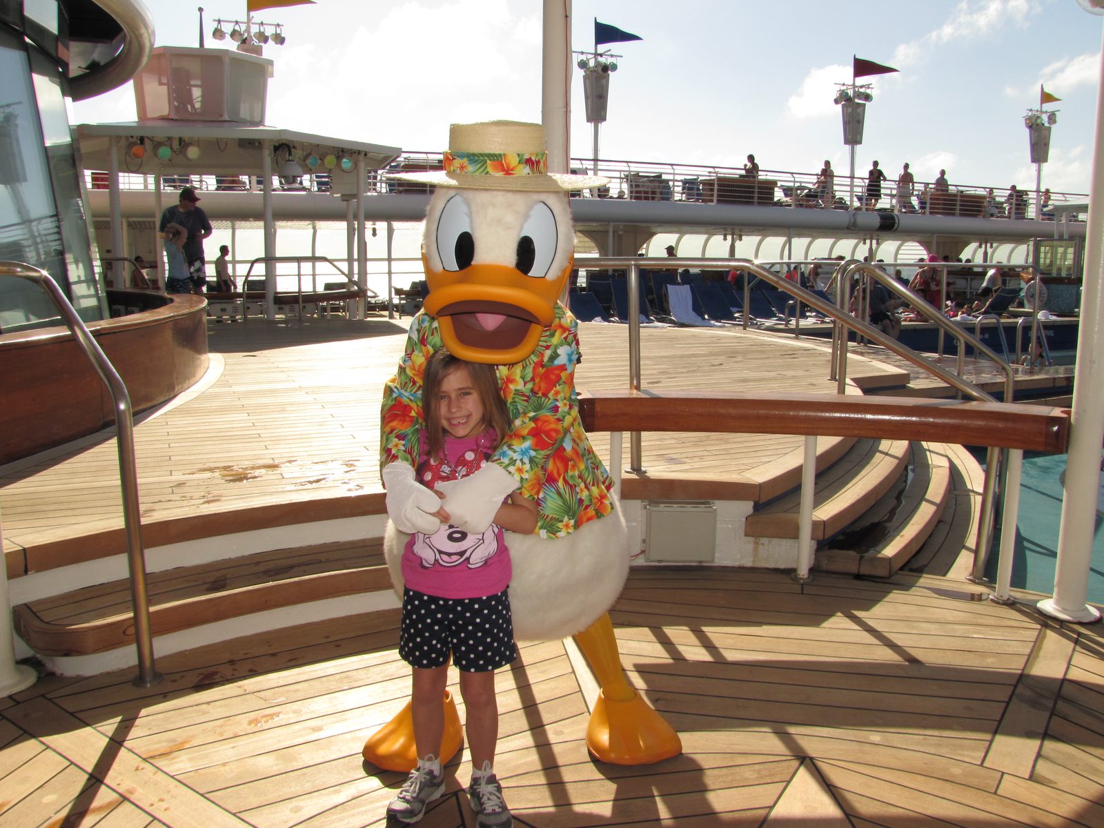 Lisa with Donald in his Hawaiian shirt and straw hat on deck