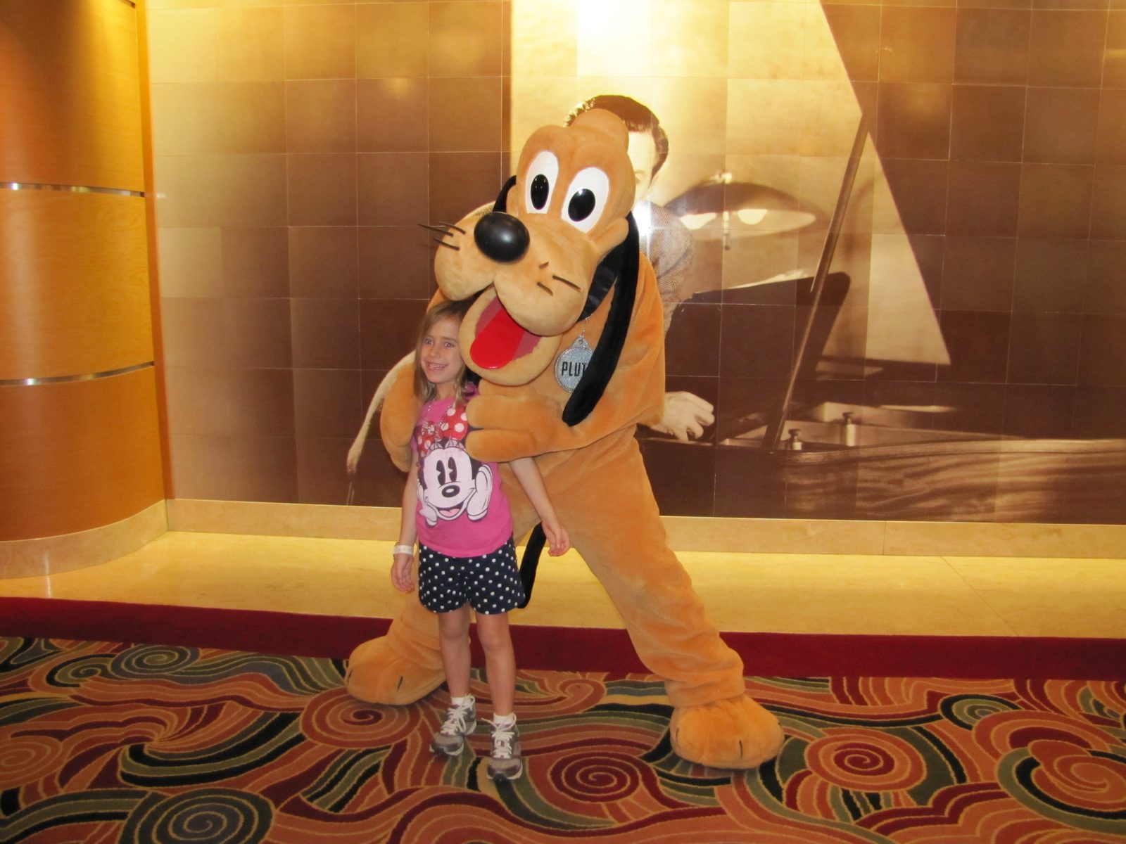 Lisa with Pluto in the Lobby Atrium