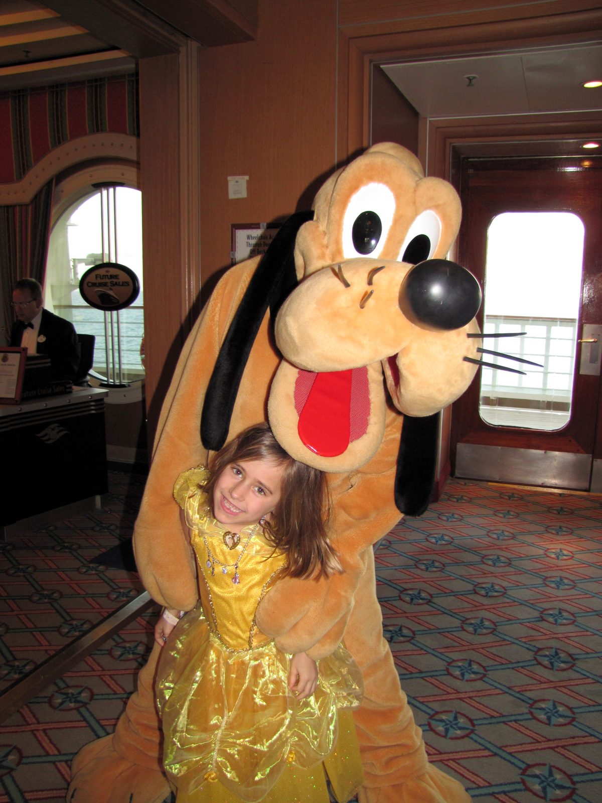 Lisa getting a hug from Pluto on Formal Night