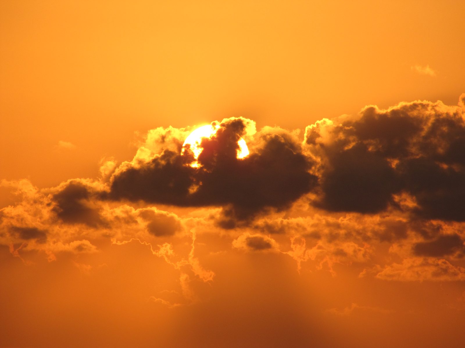 Sun coming up through the clouds off Grand Cayman