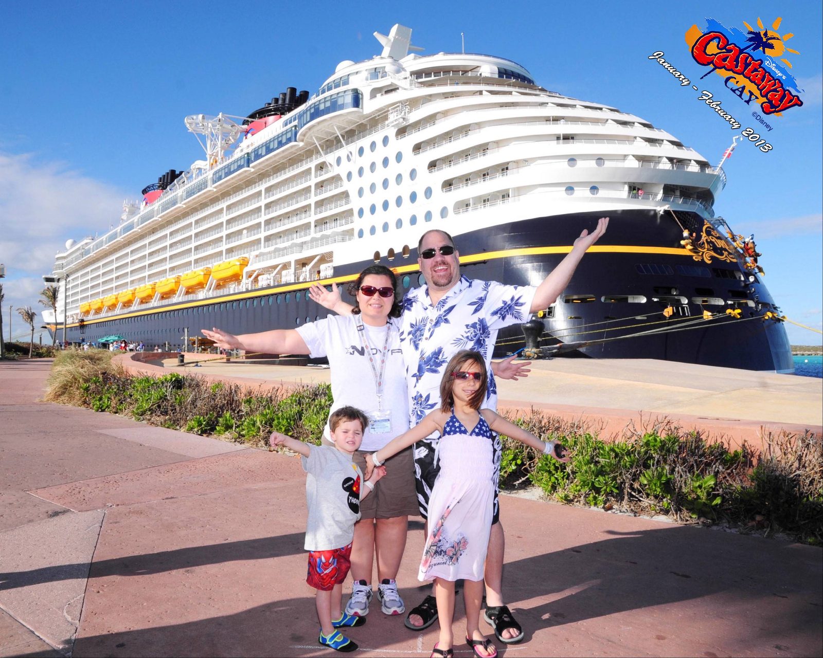 Arms out, the four of us at Castaway Cay
