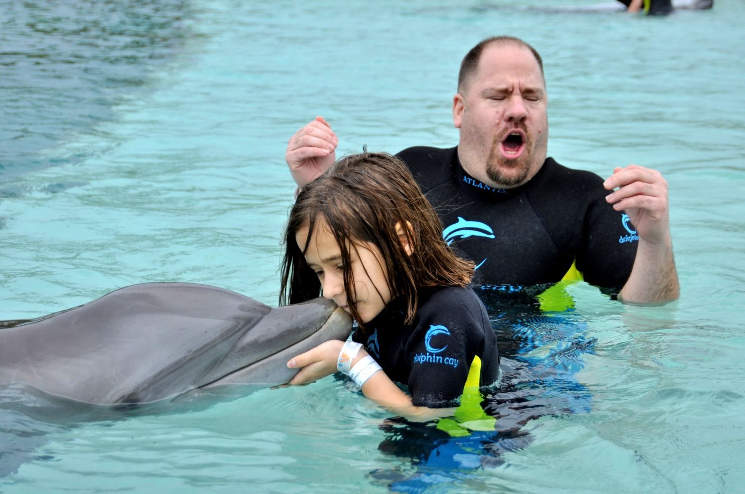 Lisa and me meeting a dolphin at Dolphin Cay