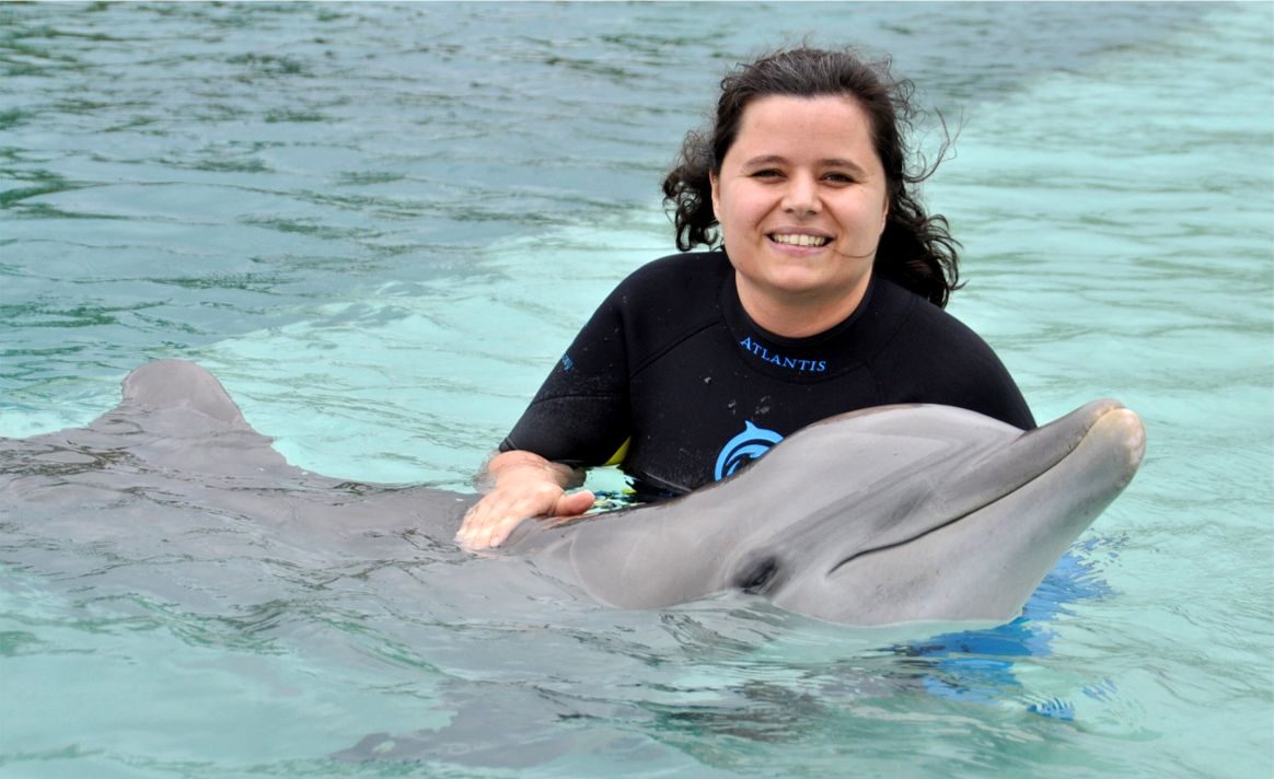 Kathy nose to nose with a dolphin