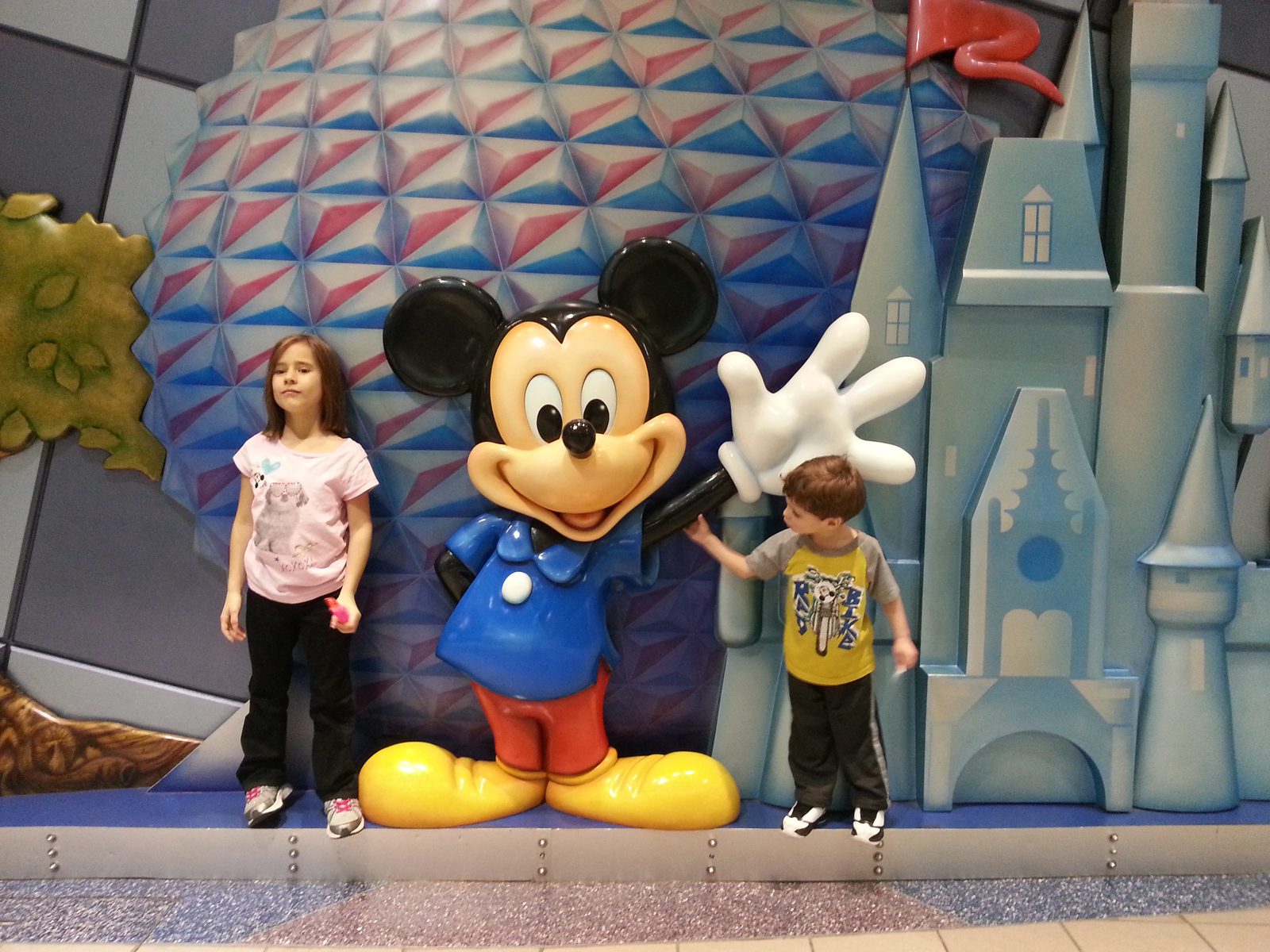 The kids waving back at Mickey's glove