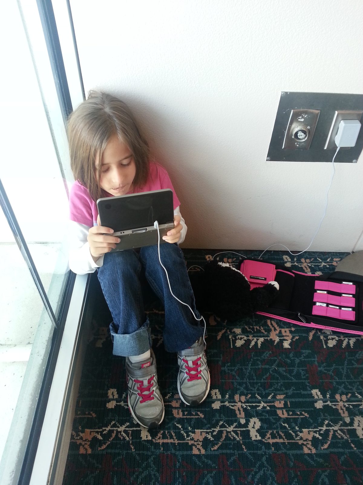 Lisa passing the time with her handheld game