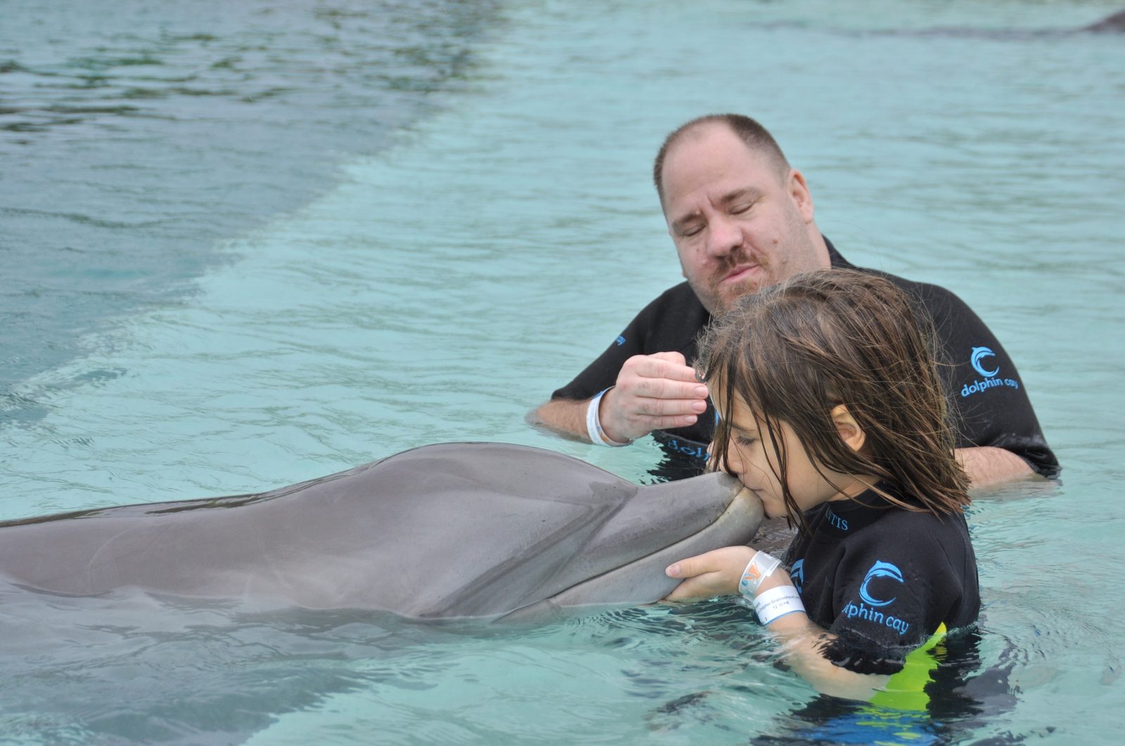Lisa and Michael with a dolphin at Dolphin Cay