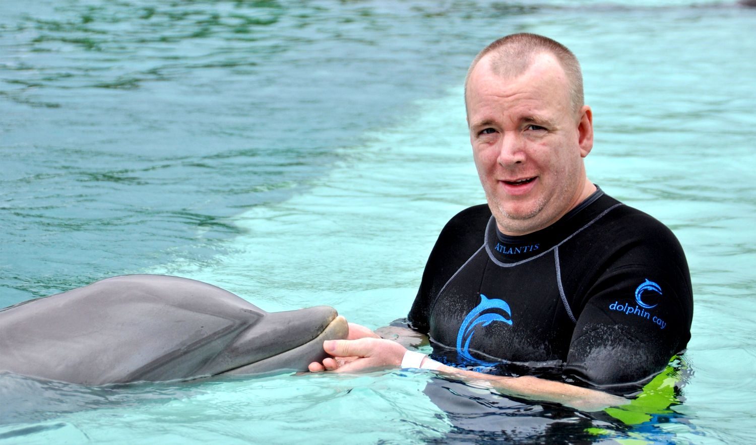 Dan meeting a dolphin at Dolphin Cay, Atlantis