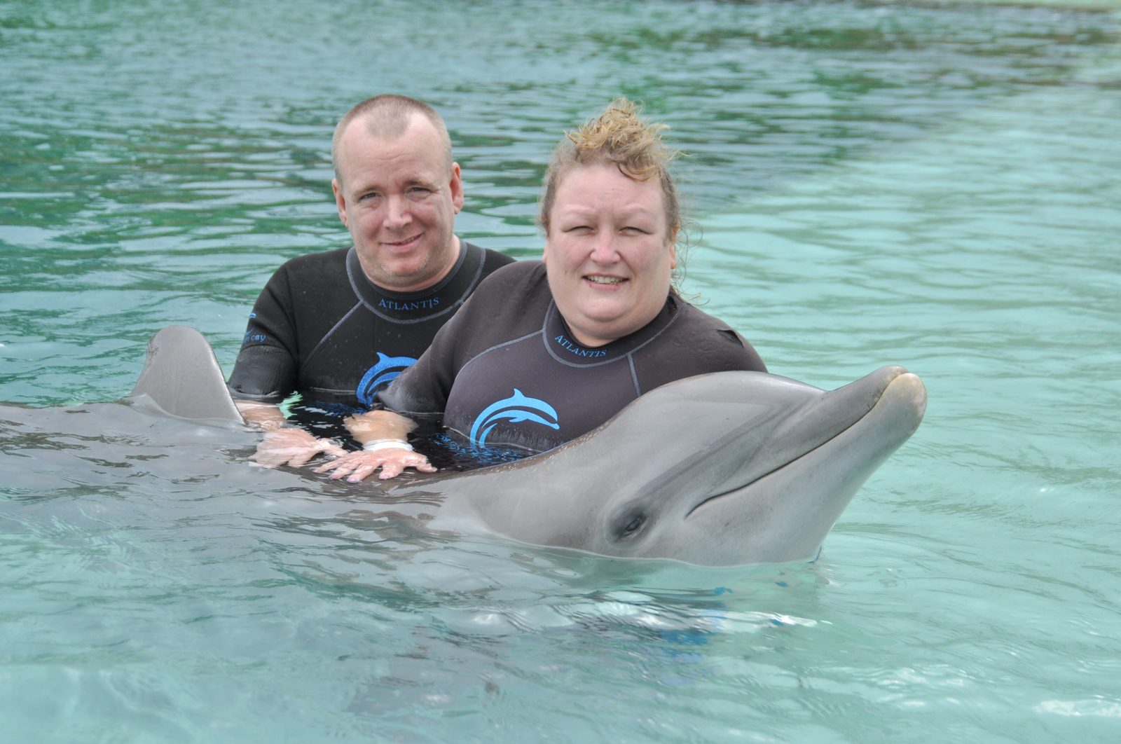 Dan and Kim with a dolphin at Dolphin Cay