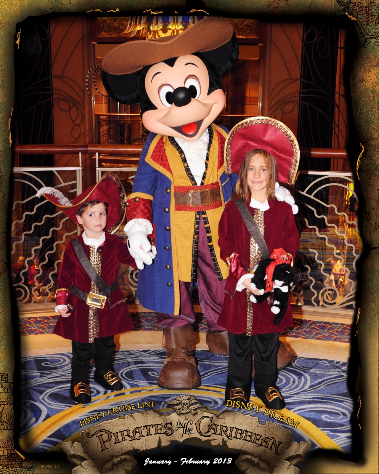 Thomas, Mickey in pirate garb and Lisa on Pirate Night in the Lobby Atrium