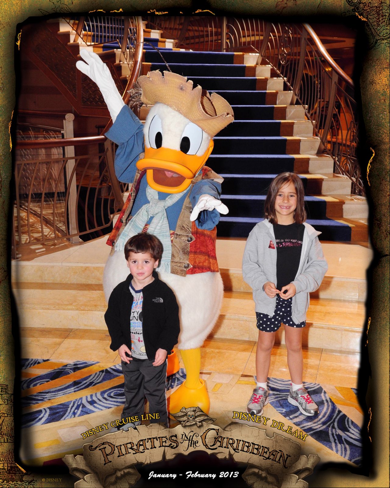 Thomas and Lisa with Donald in pirate garb on Pirate Night in the Lobby Atrium
