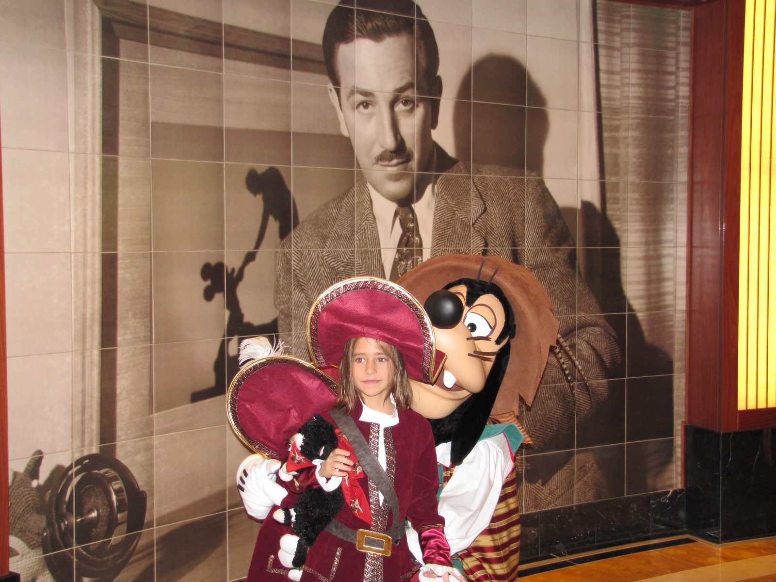 Lisa with Goofy in pirate garb on Pirate Night in the Lobby Atrium