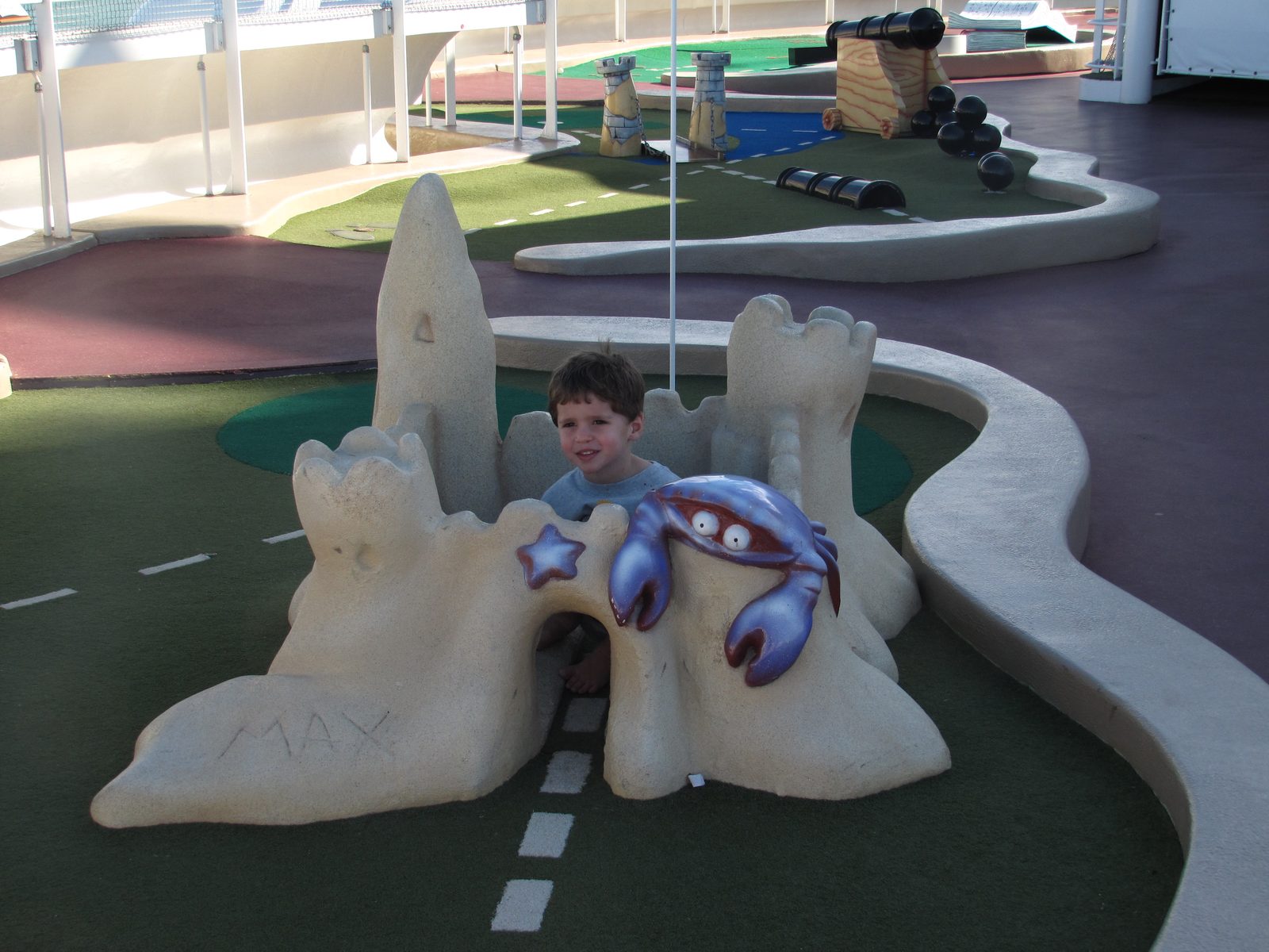 Thomas in the sand castle at Goofy mini golf