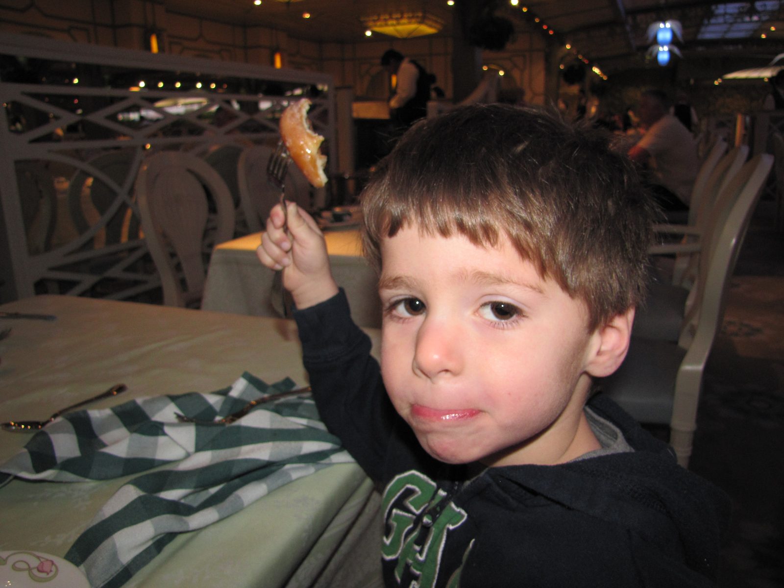 Thomas savoring breakfast before our flight