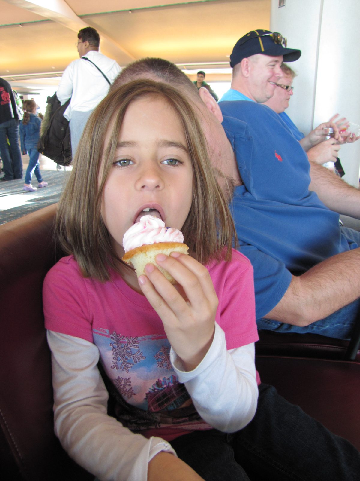 Lisa with an airport cupcake treat