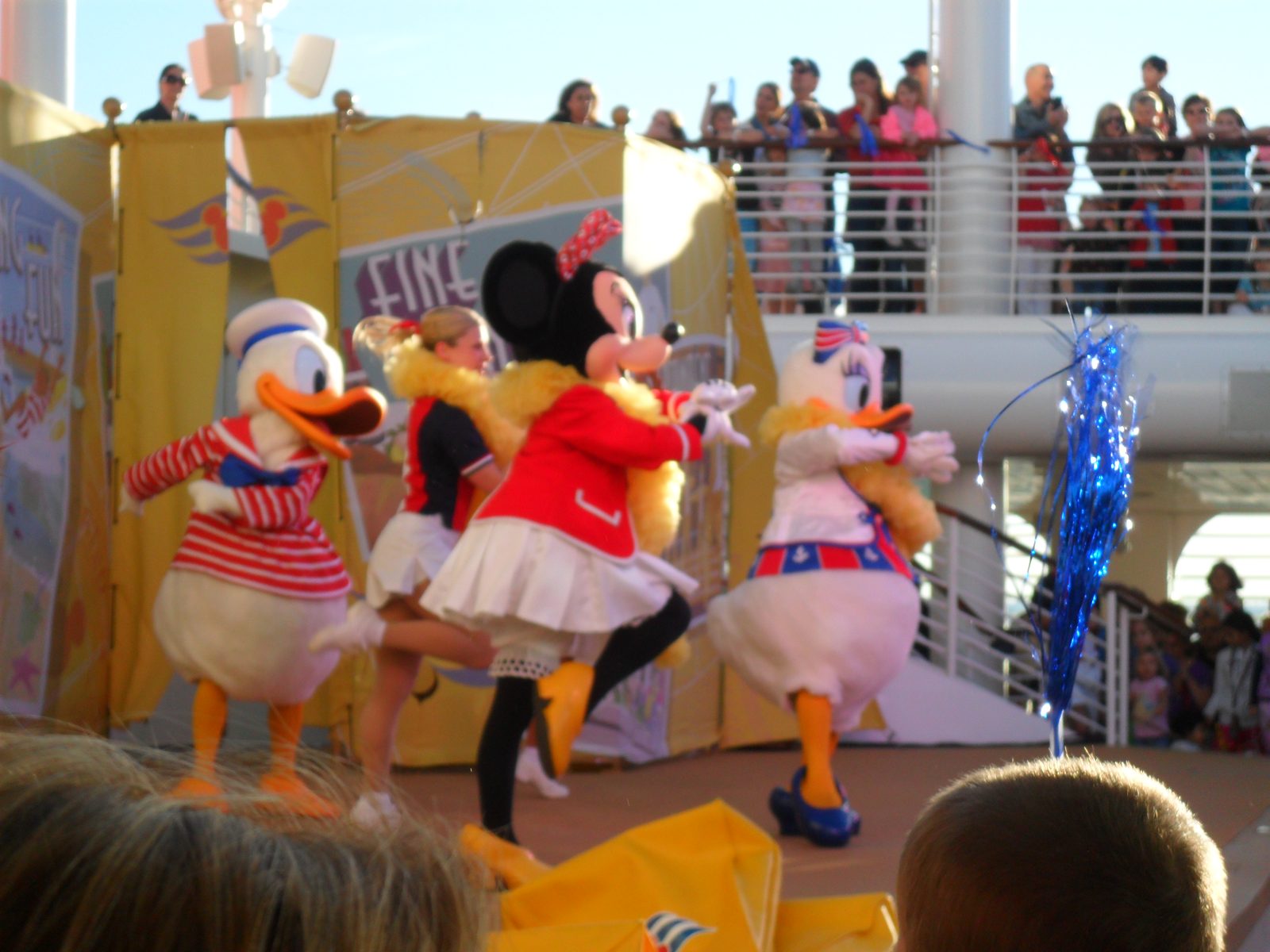 Donald, Minnie and Daisy in their sailor outfits dancing at the Sailing Away party