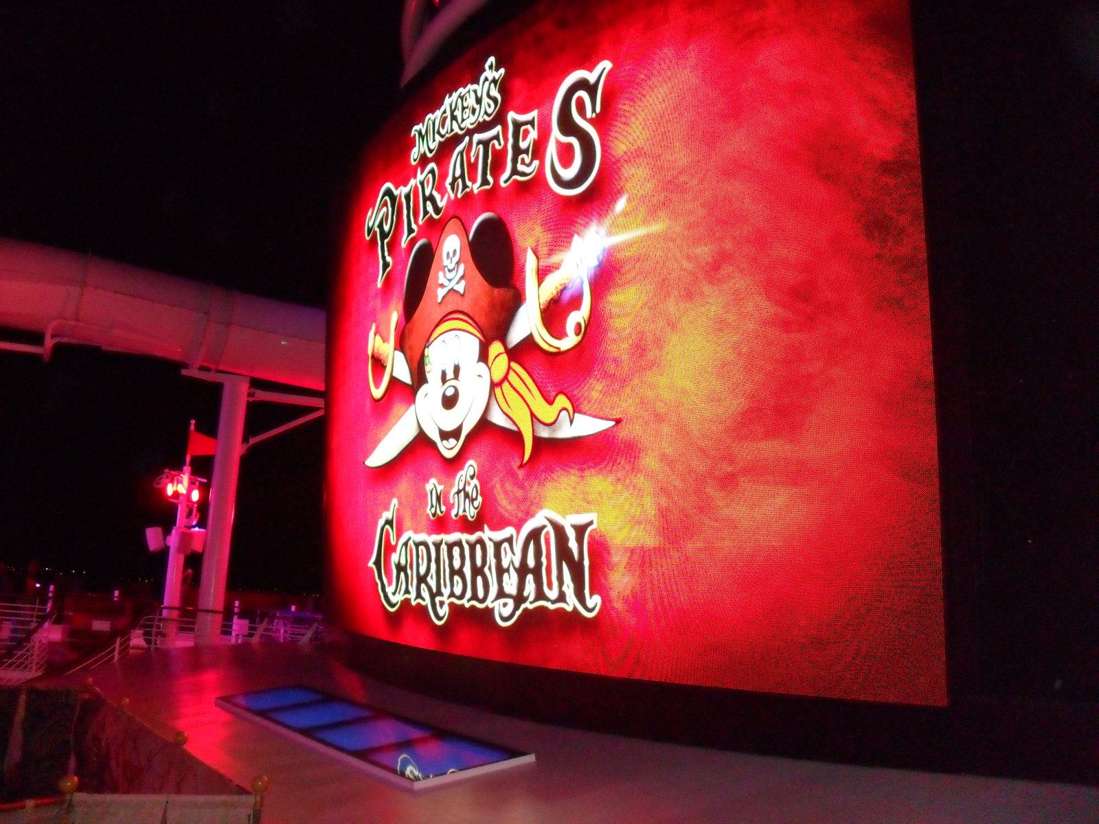 The Pirates in the Caribbean sign lit up on deck