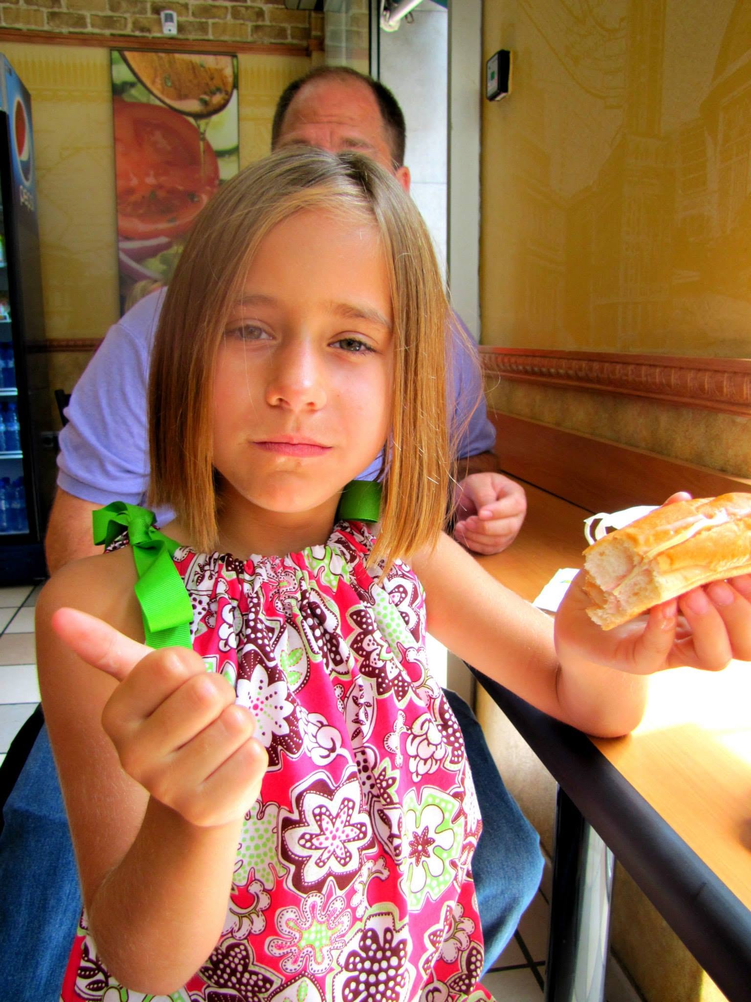 Lisa gives her sandwich a thumbs up at Park Guell