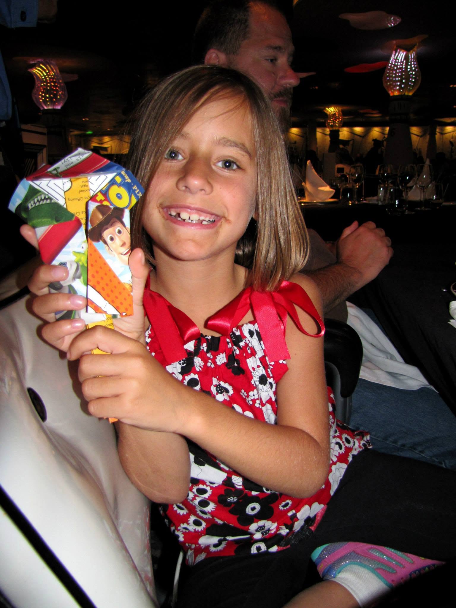 Lisa with her origami talking duck at dinner