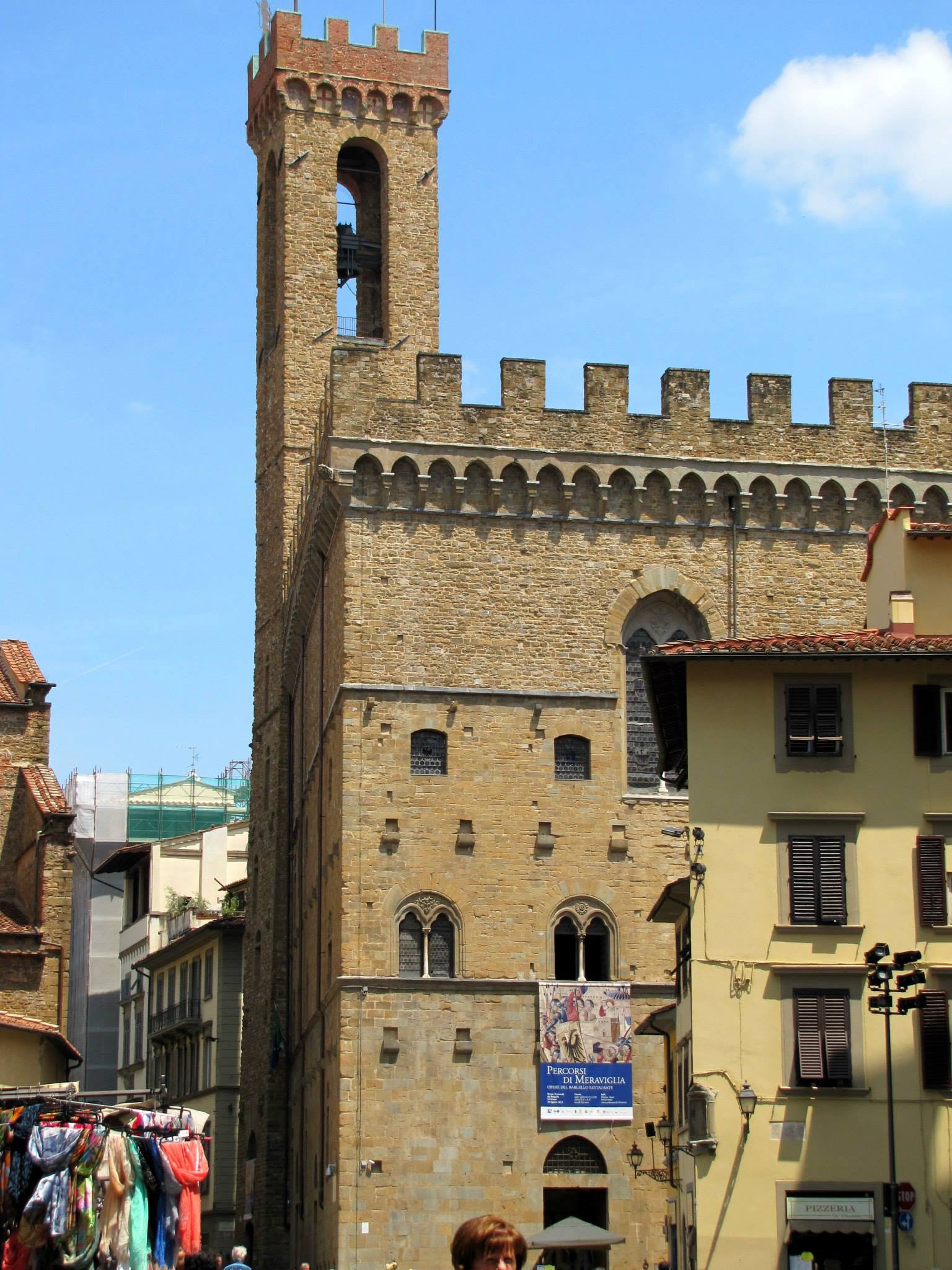 A crenellated tower on a square in Florence