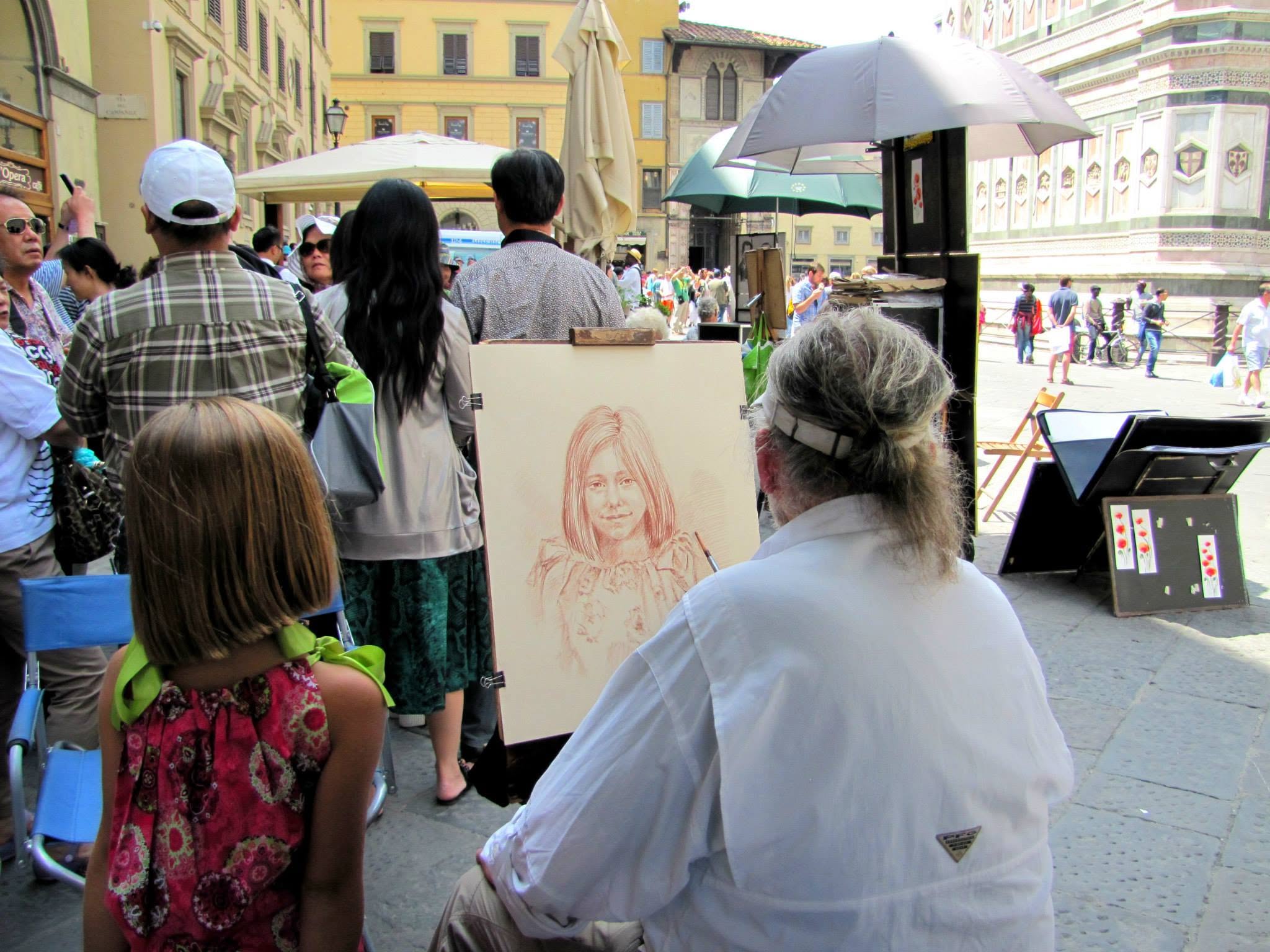 Lisa checking the work on her portrait