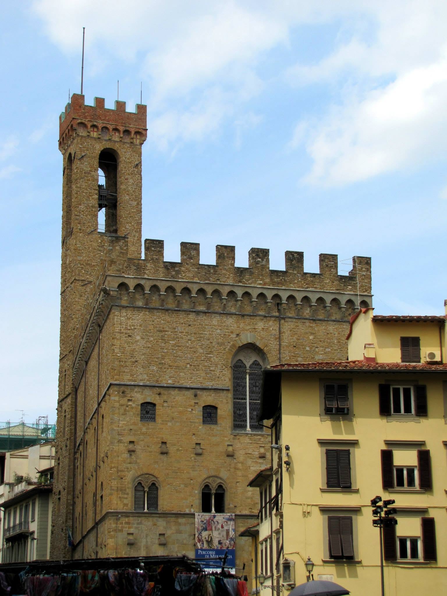 A battlemented tower over the Florence rooftops